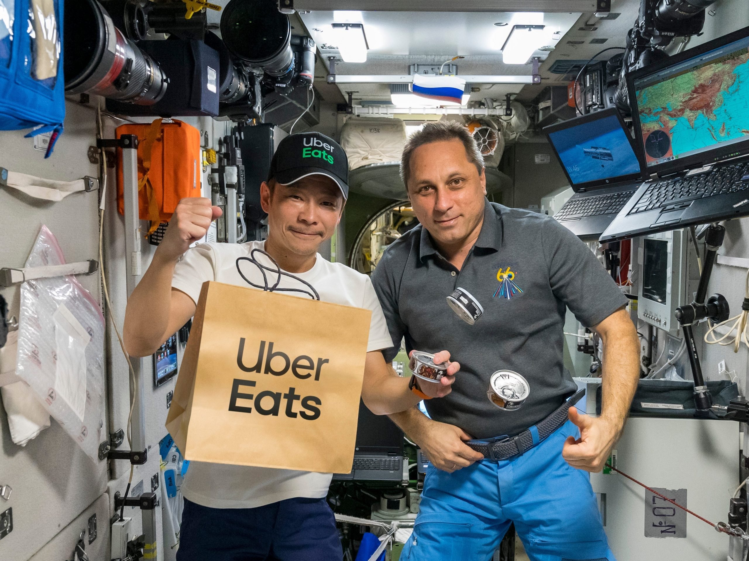 Yusaku Maezawa with an ISS astronaut and an Uber Eats delivery