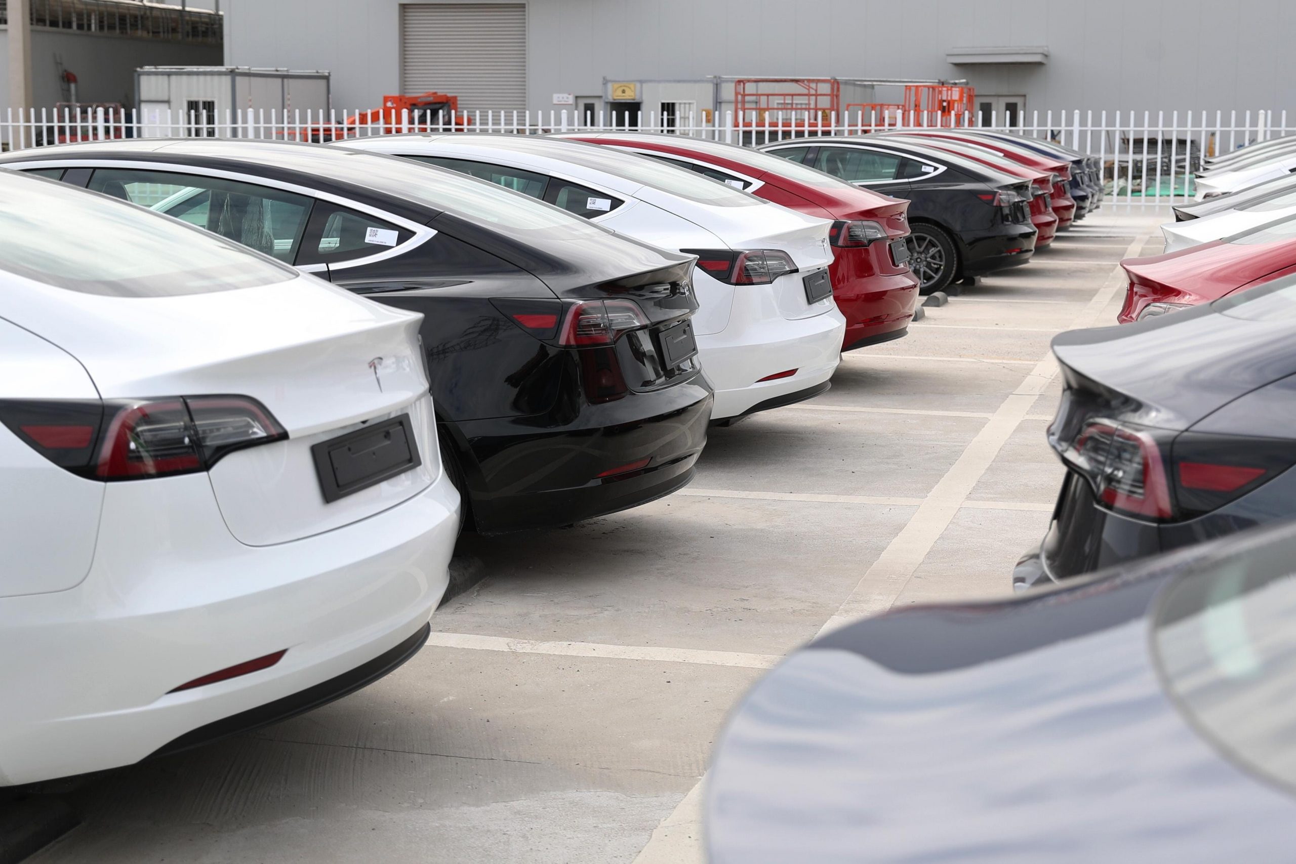 Tesla Model 3 vehicles wait to be transported during the Tesla Gigafactory Shanghai Ceremony of China-made Vehicles Exporting to Europe on October 26, 2020 in Shanghai, China.