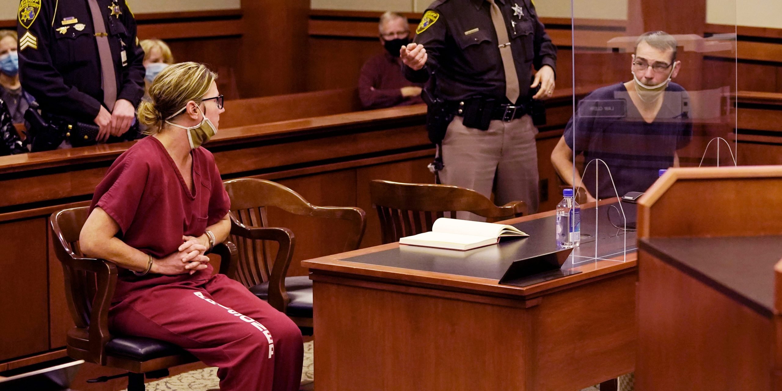 James Crumbley, right, looks towards his wife Jennifer Crumbley during a court hearing in Rochester Hills, Mich., Dec. 14, 2021.