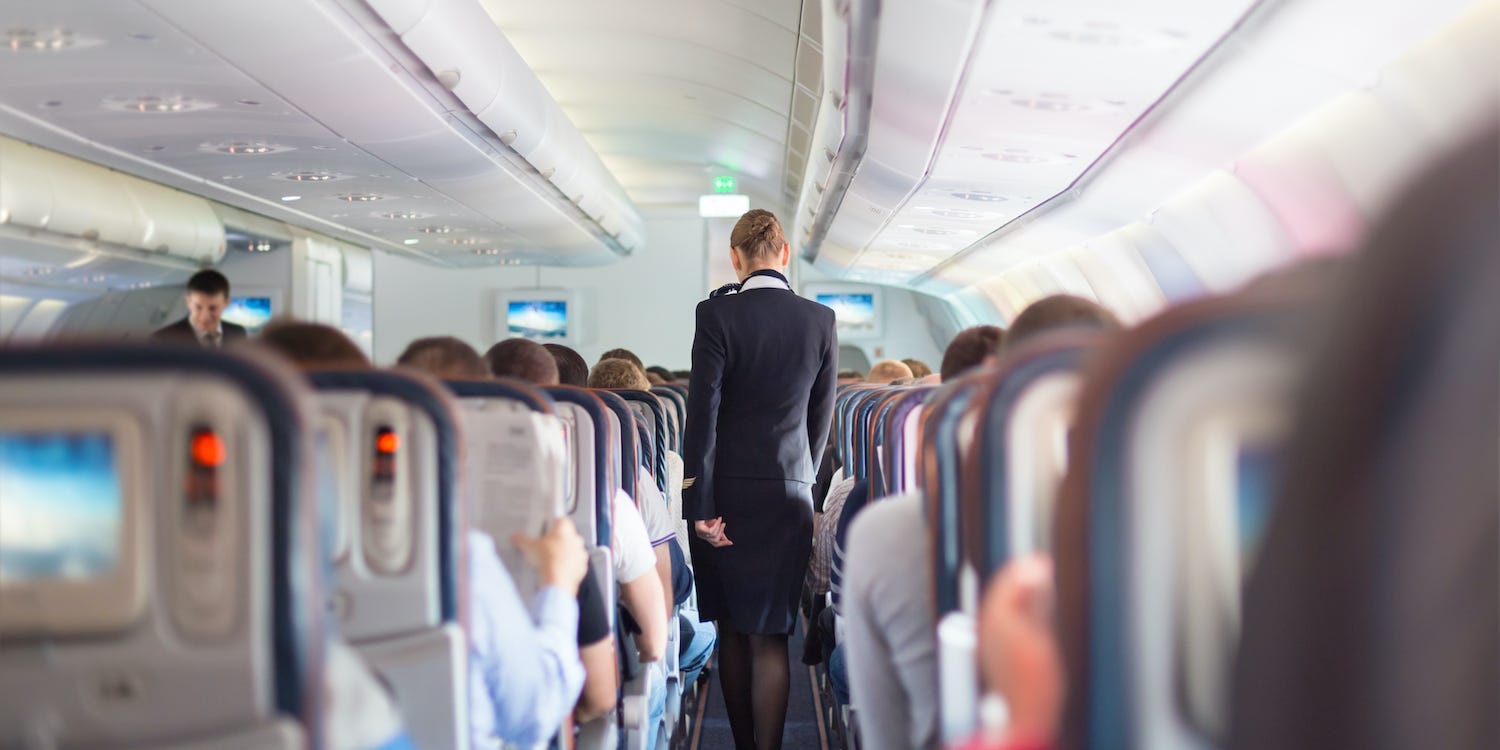 A flight attendant on an airplane.