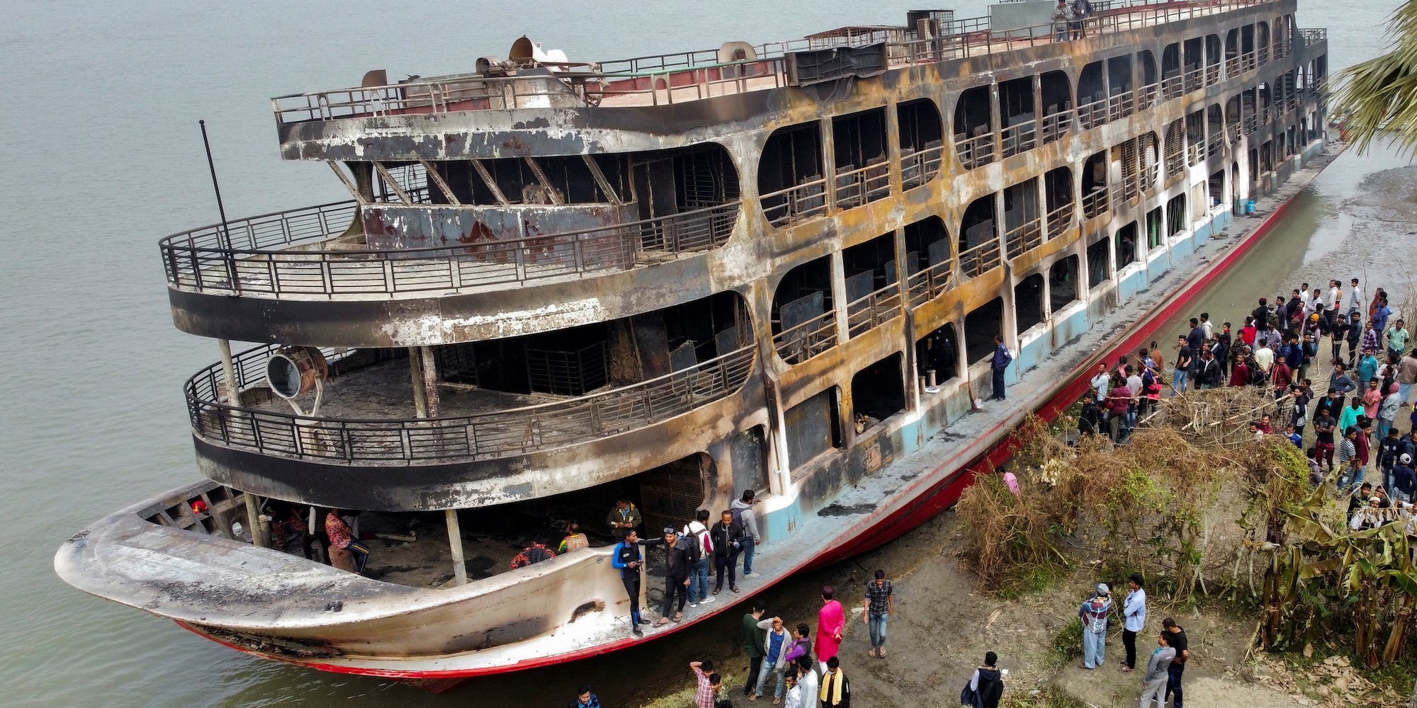 A burnt ferry on the shore