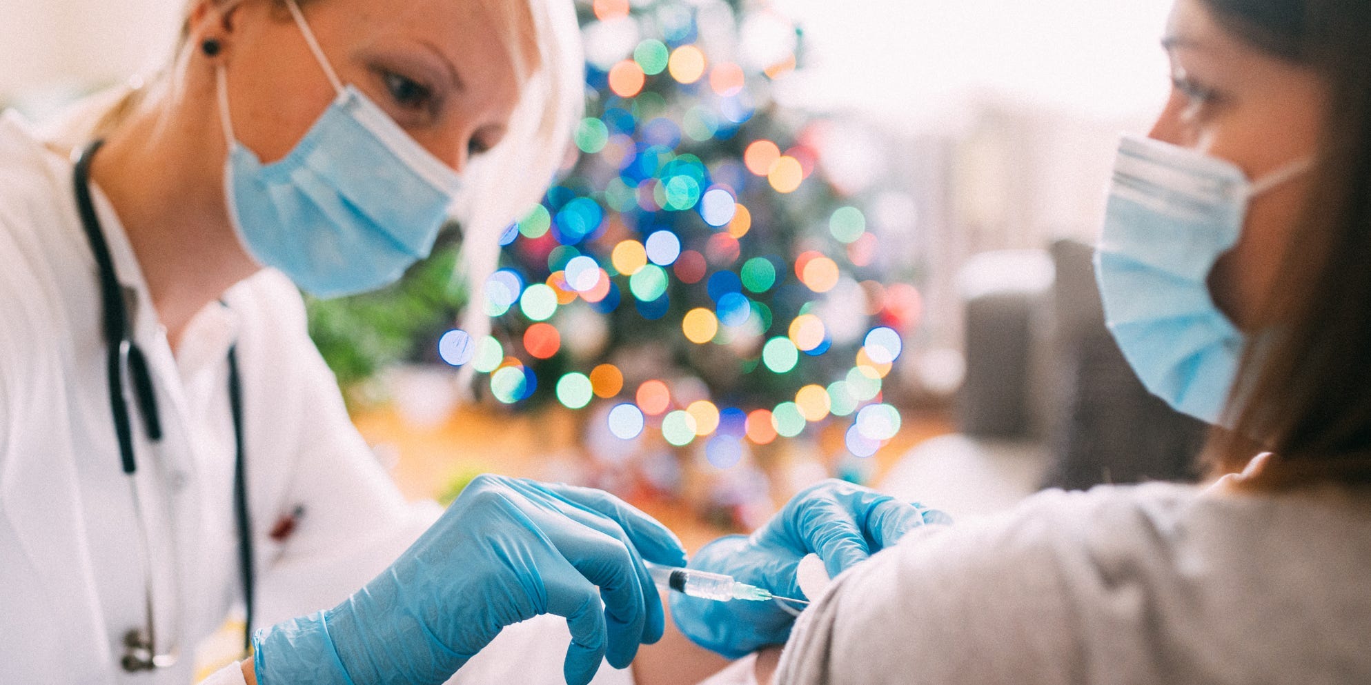 A young female gets vaccinated at home during pandemic times