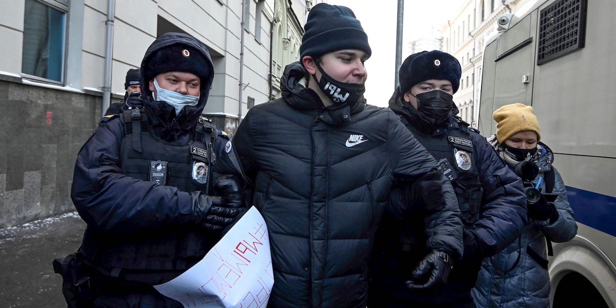 Russian police officers arresting a protestor