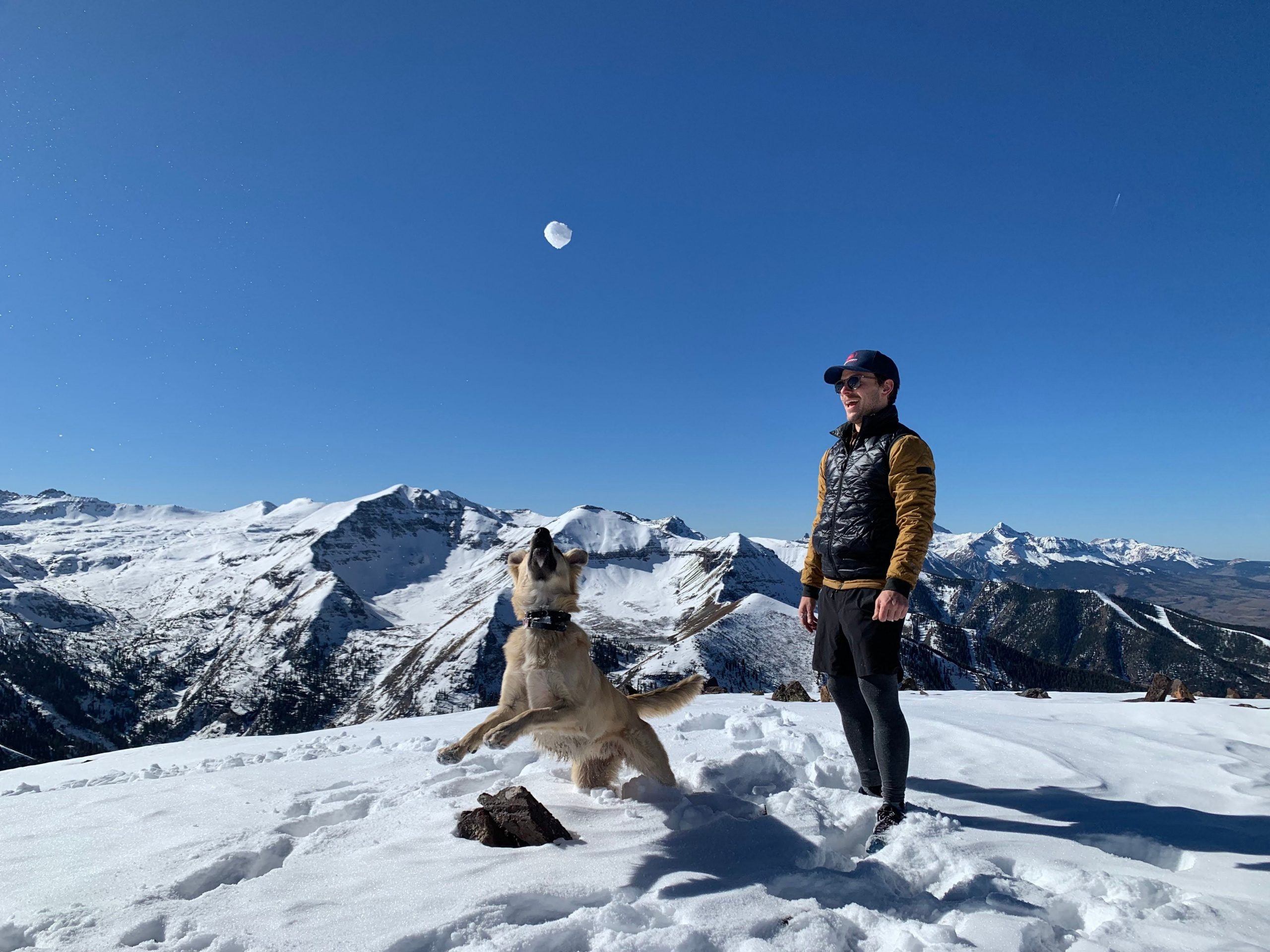 Ty Wilson with his roommate's dog, Boru, at the top of Ajax Peak, which overlooks Telluride.