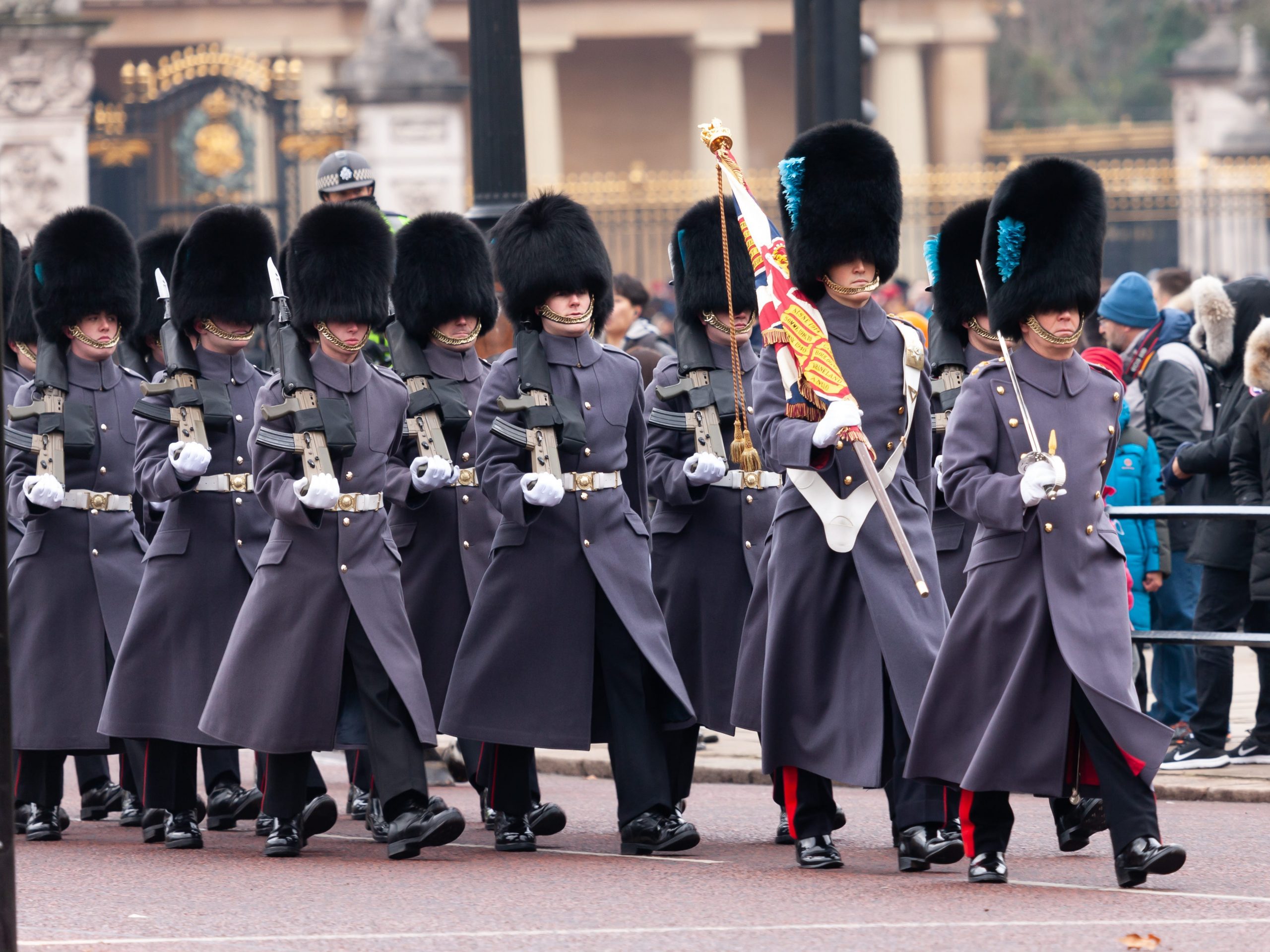 Soldiers of the Irish Guards march from Buckingham Palace along The Mall during the traditional changing of the guard ceremonies.