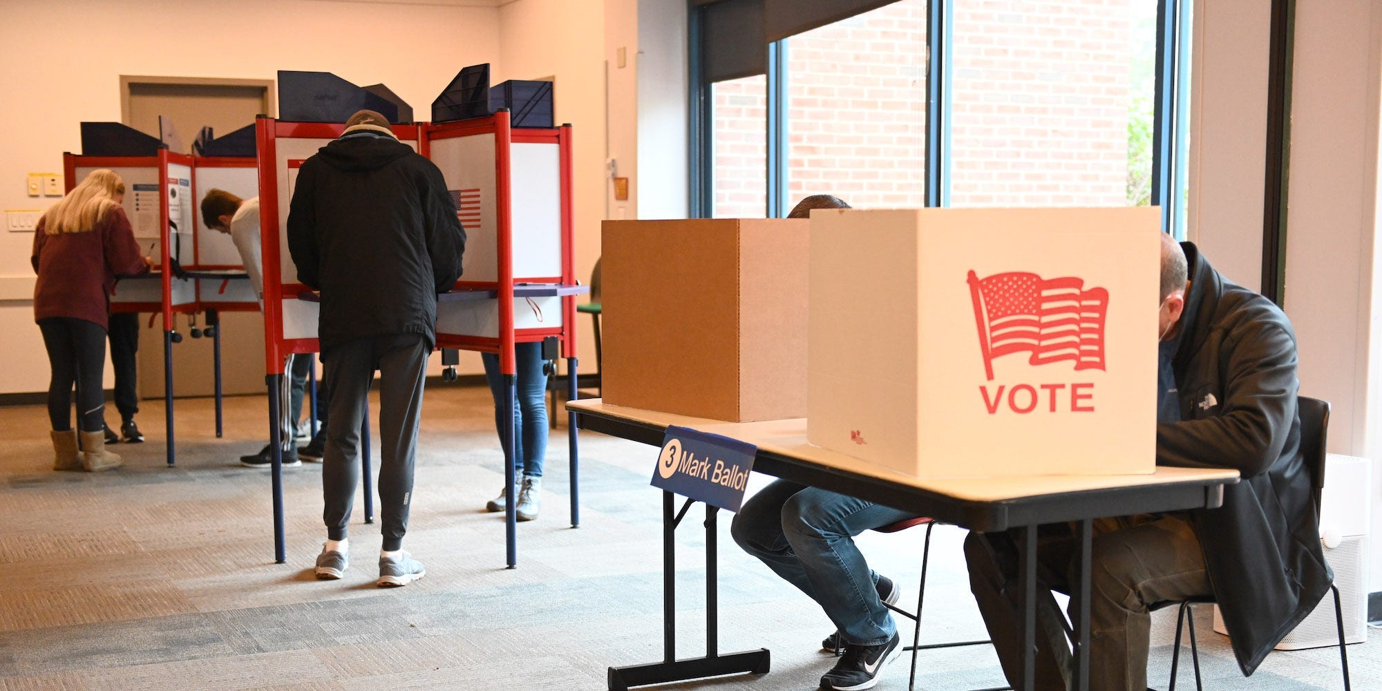 Voters cast ballots at a polling location in Arlington during the Virginia governor election on November 2, 2021 in Virginia, United States