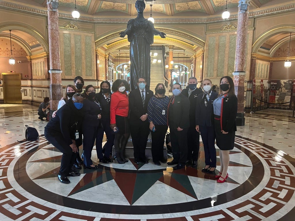 Corliss King and her coalition of flight attendant supports with House Representatives Joyce Mason and Sam Yingling the day the law passed the House