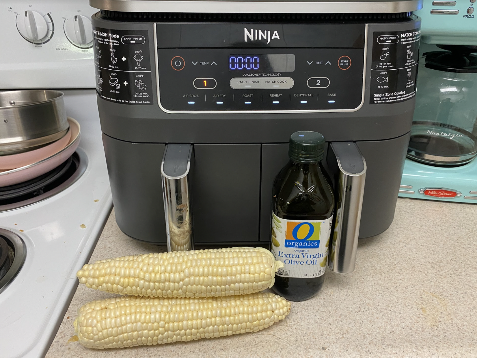 Air fryer, corn, and olive oil.