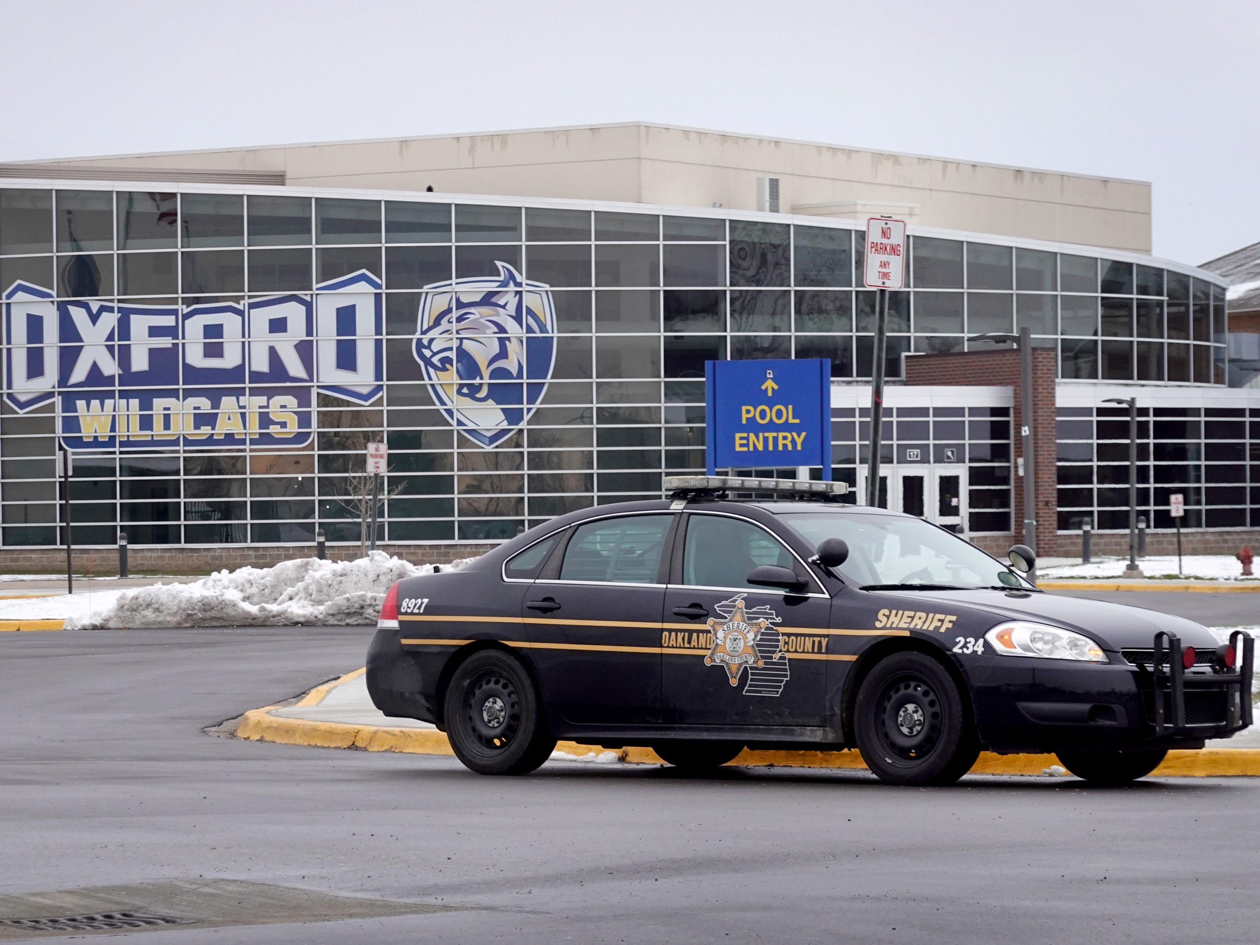 A police vehicle remains parked outside of Oxford High School on December 01, 2021 in Oxford, Michigan.