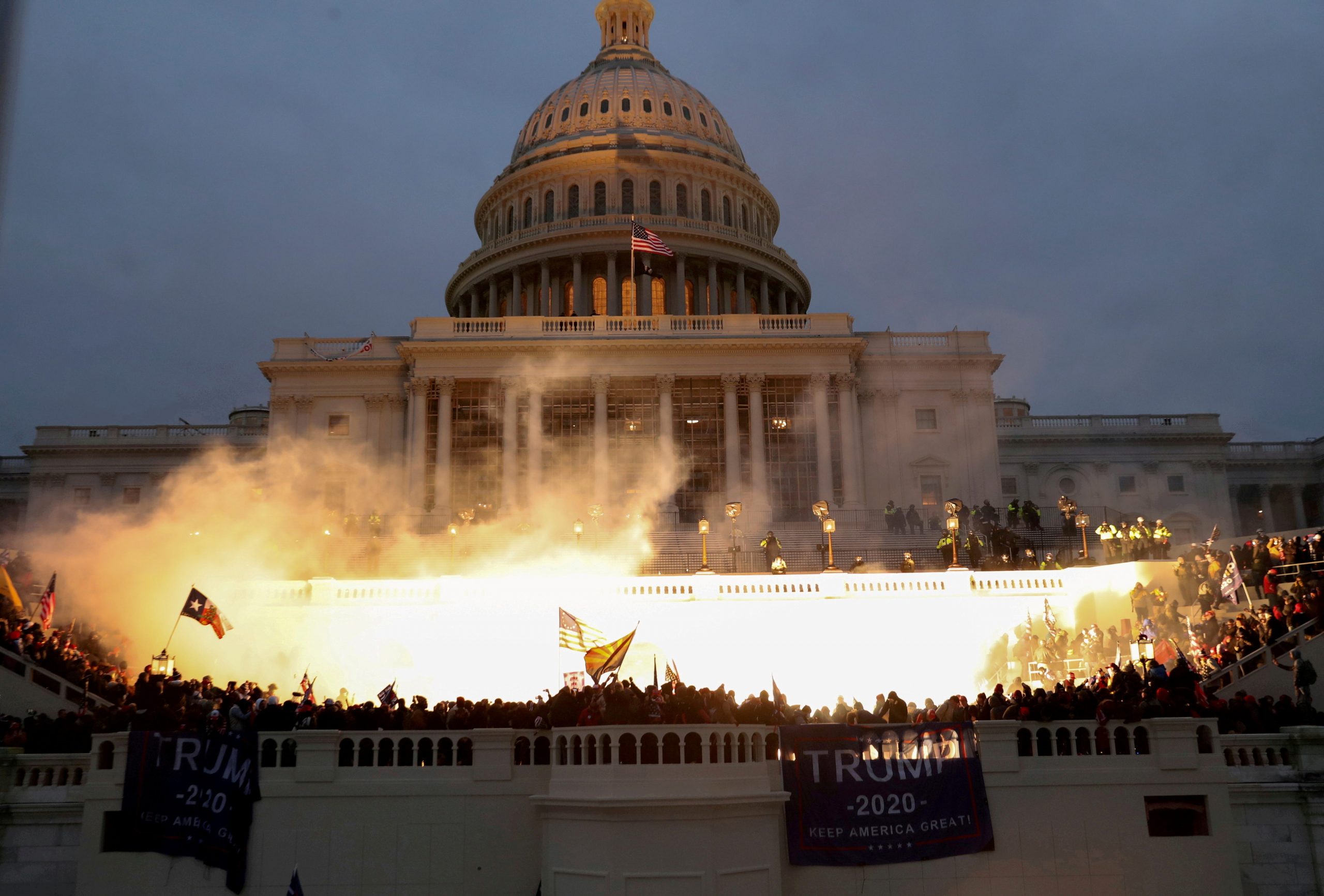 An explosion caused by a police munition is seen while supporters of U.S. President Donald Trump riot in front of the U.S. Capitol Building in Washington, U.S., January 6, 2021.