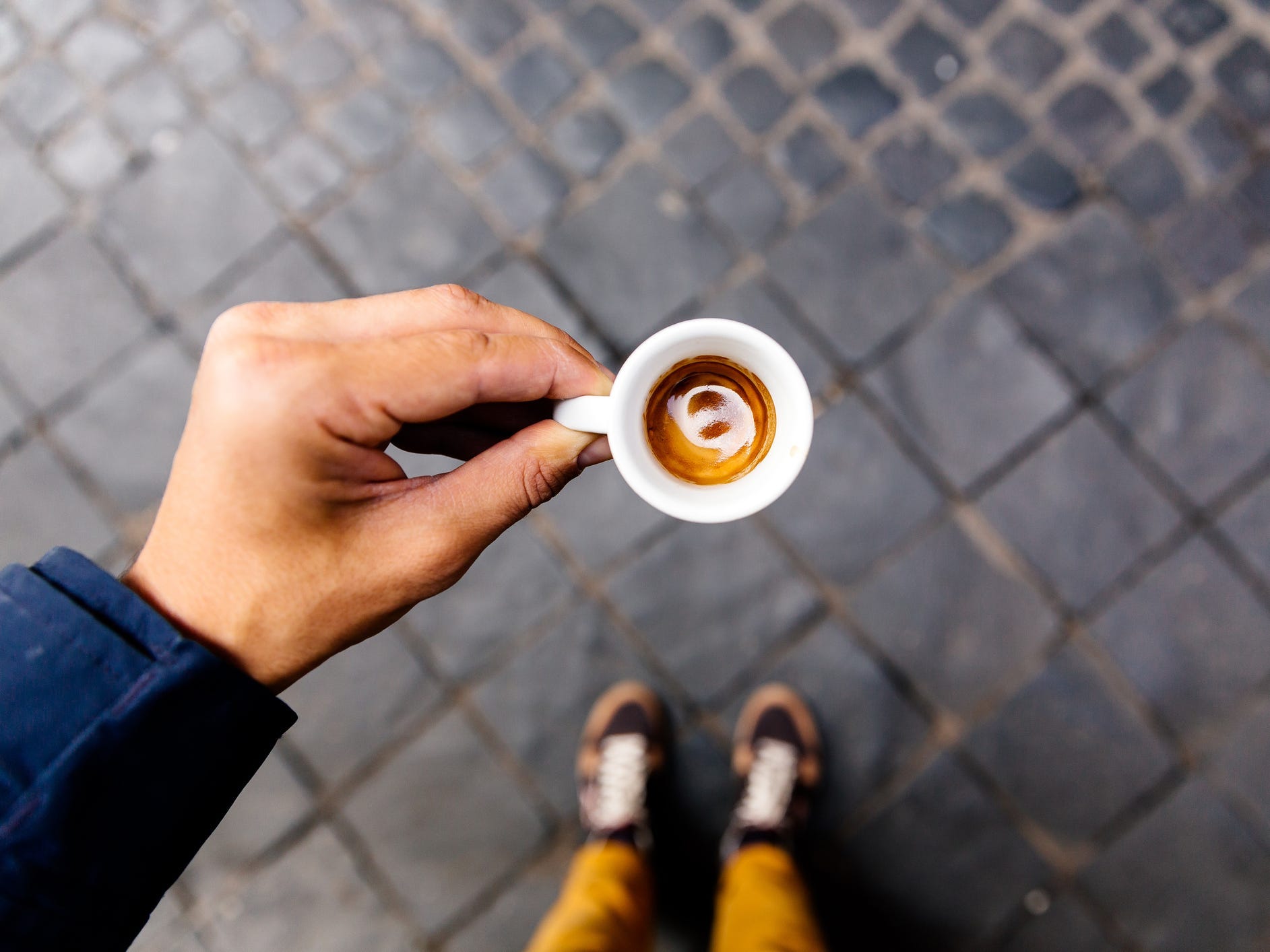Drinking espresso on the streets of Rome, personal perspective view.
