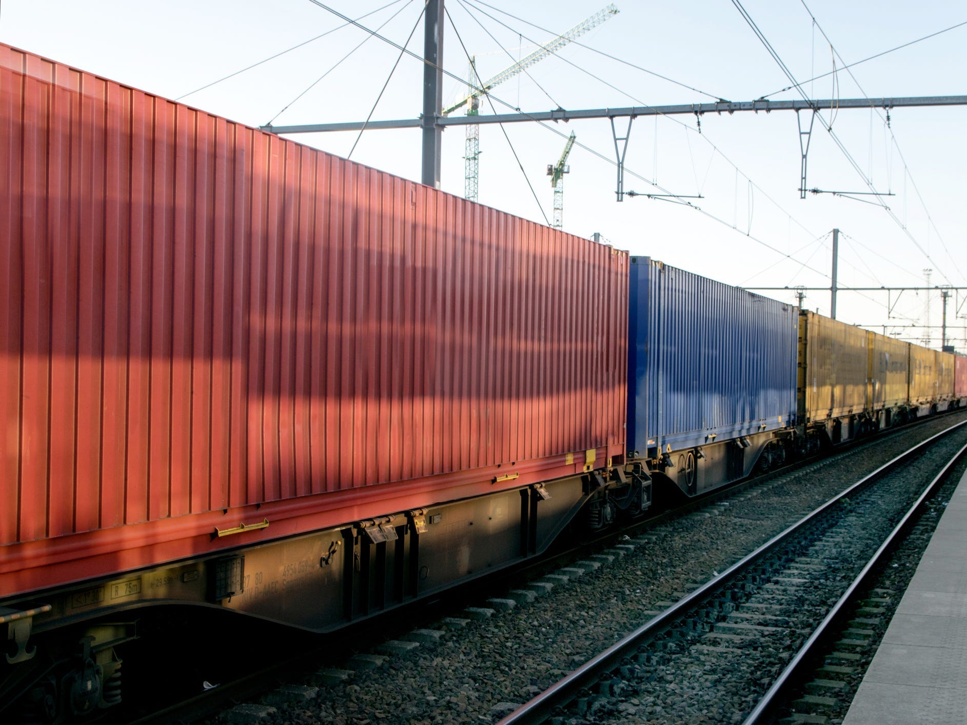 Freight train hauls shipping containers.