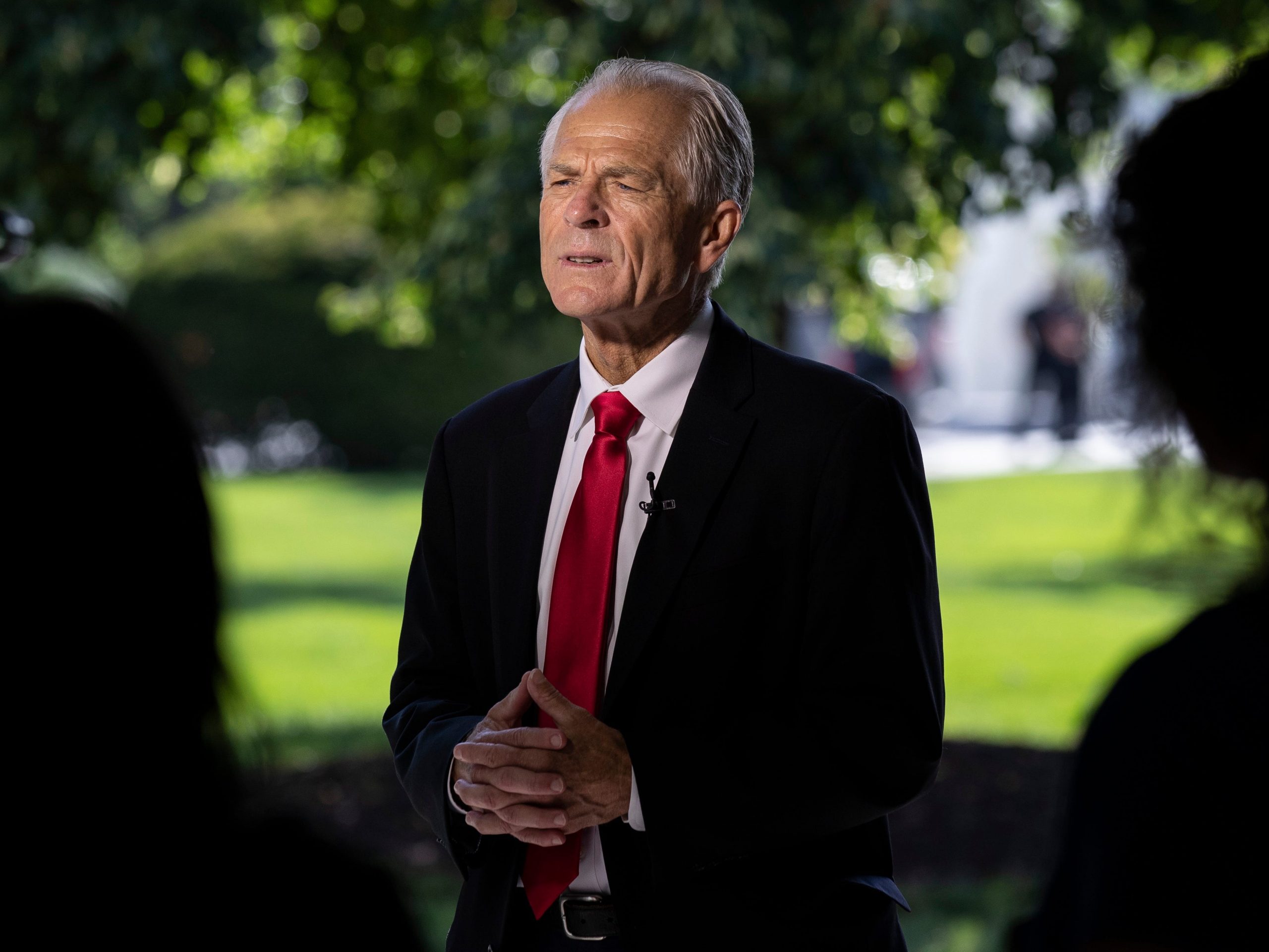 White House trade adviser Peter Navarro stands before a television interview at the White House, Monday, Aug. 3, 2020, in Washington.