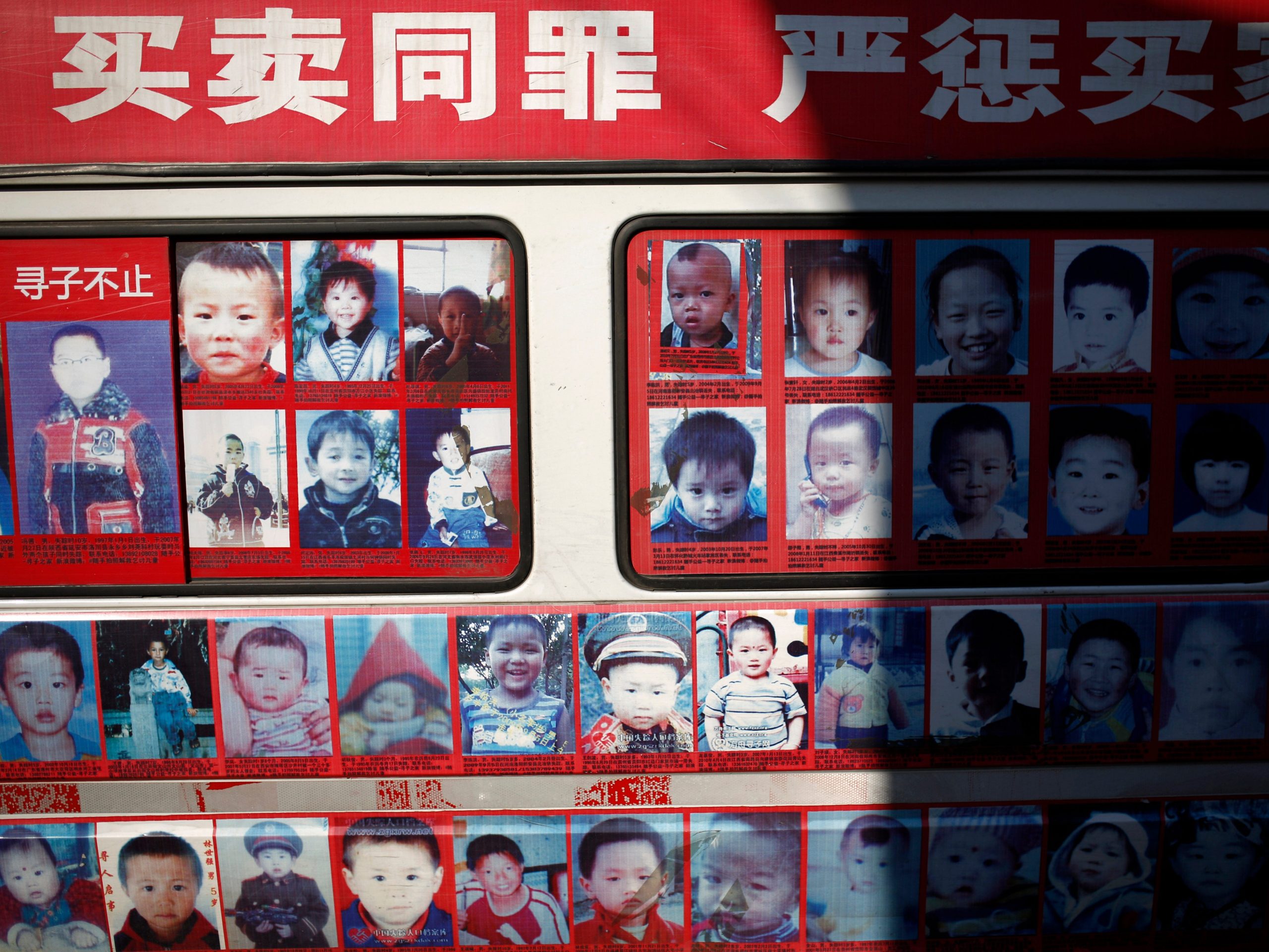 A van displaying photos of the missing children across China.