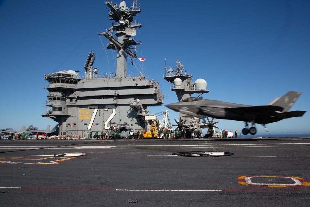 An F-35C Lightning II, assigned to Marine Wing Fighter Attack Squadron (VMFA) 314, lands on the flight deck of the aircraft carrier USS Abraham Lincoln (CVN 72)