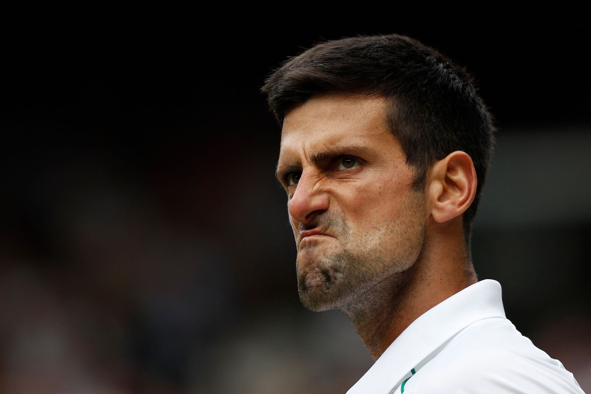 Serbia's Novak Djokovic celebrates apoint against Italy's Matteo Berrettini during their men's singles final match on the thirteenth day of the 2021 Wimbledon Championships at The All England Tennis Club in Wimbledon