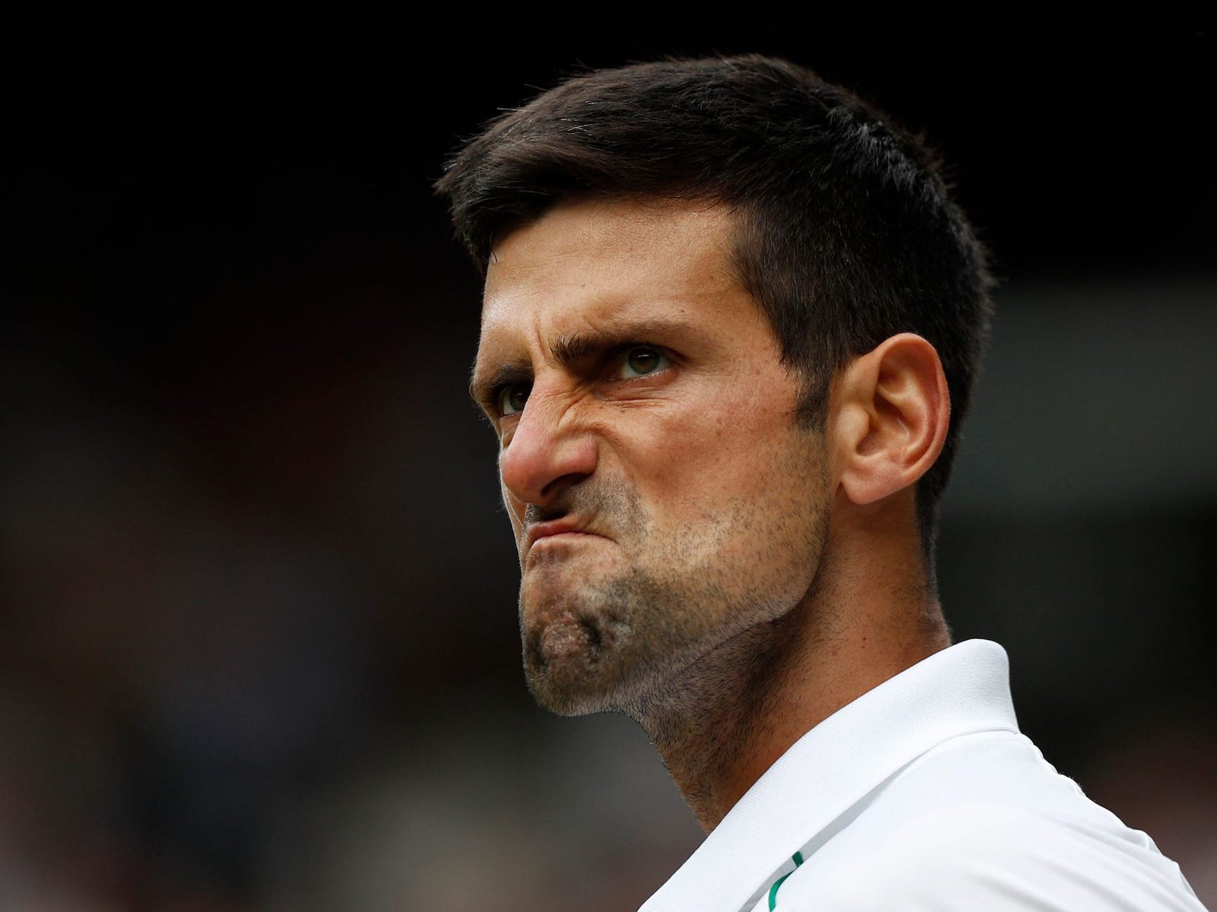 Serbia's Novak Djokovic celebrates apoint against Italy's Matteo Berrettini during their men's singles final match on the thirteenth day of the 2021 Wimbledon Championships at The All England Tennis Club in Wimbledon