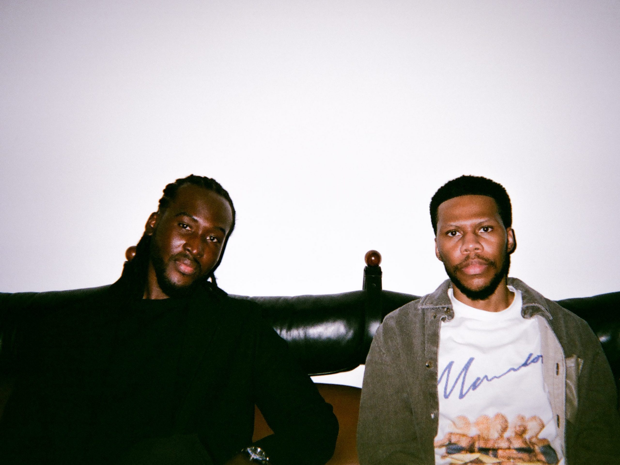 Photo of two men smiling at the camera