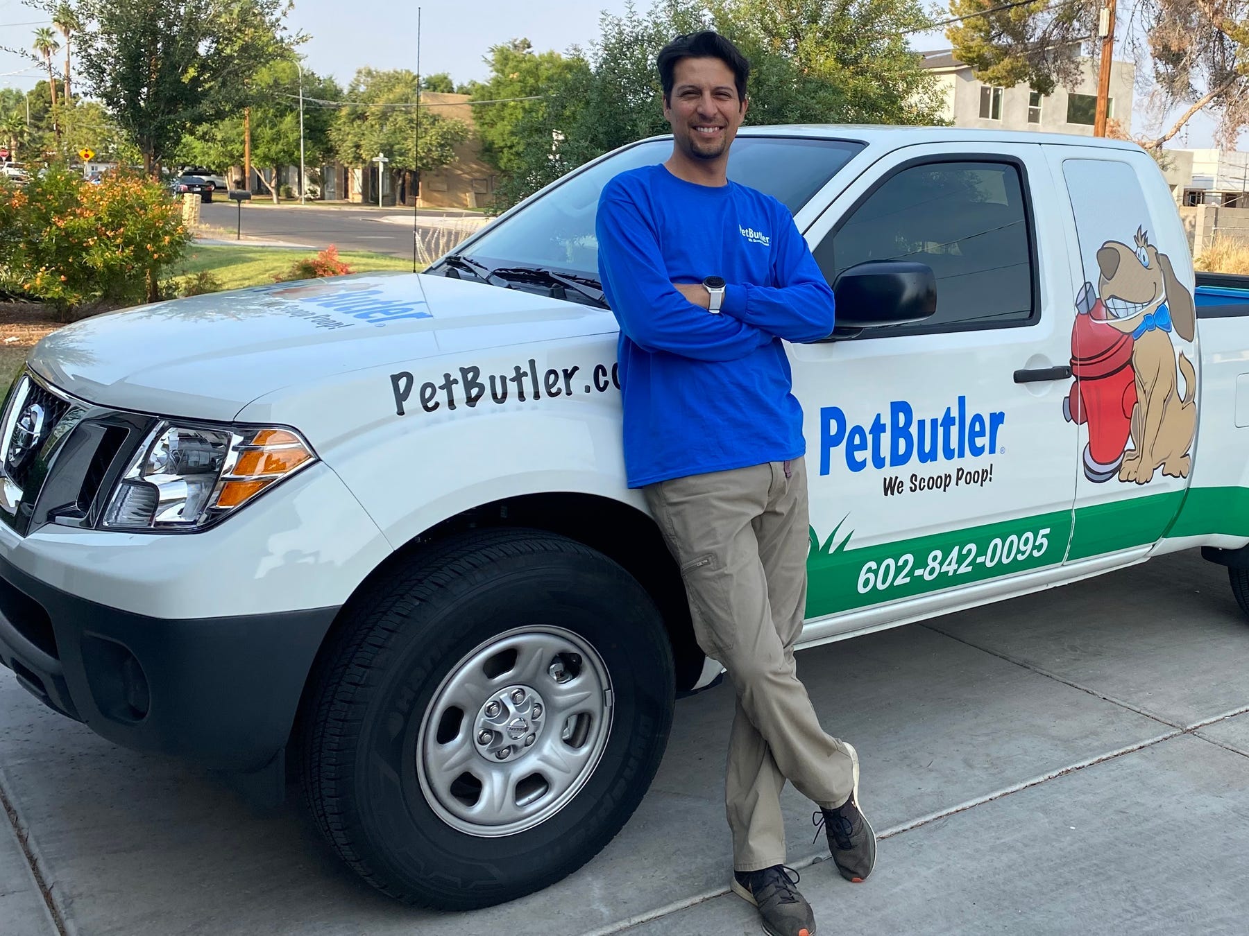 Cesar Jimenez in front of his Pet Butler branded truck,