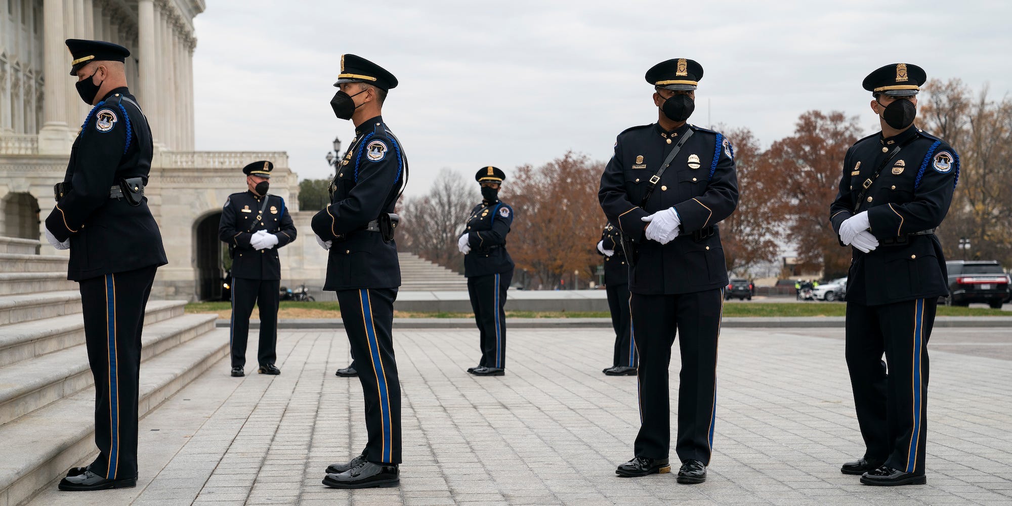 Capitol Police are seen before a military honor guard carries the casket of Bob Dole after lying in state at the Capitol on December 10, 2021.
