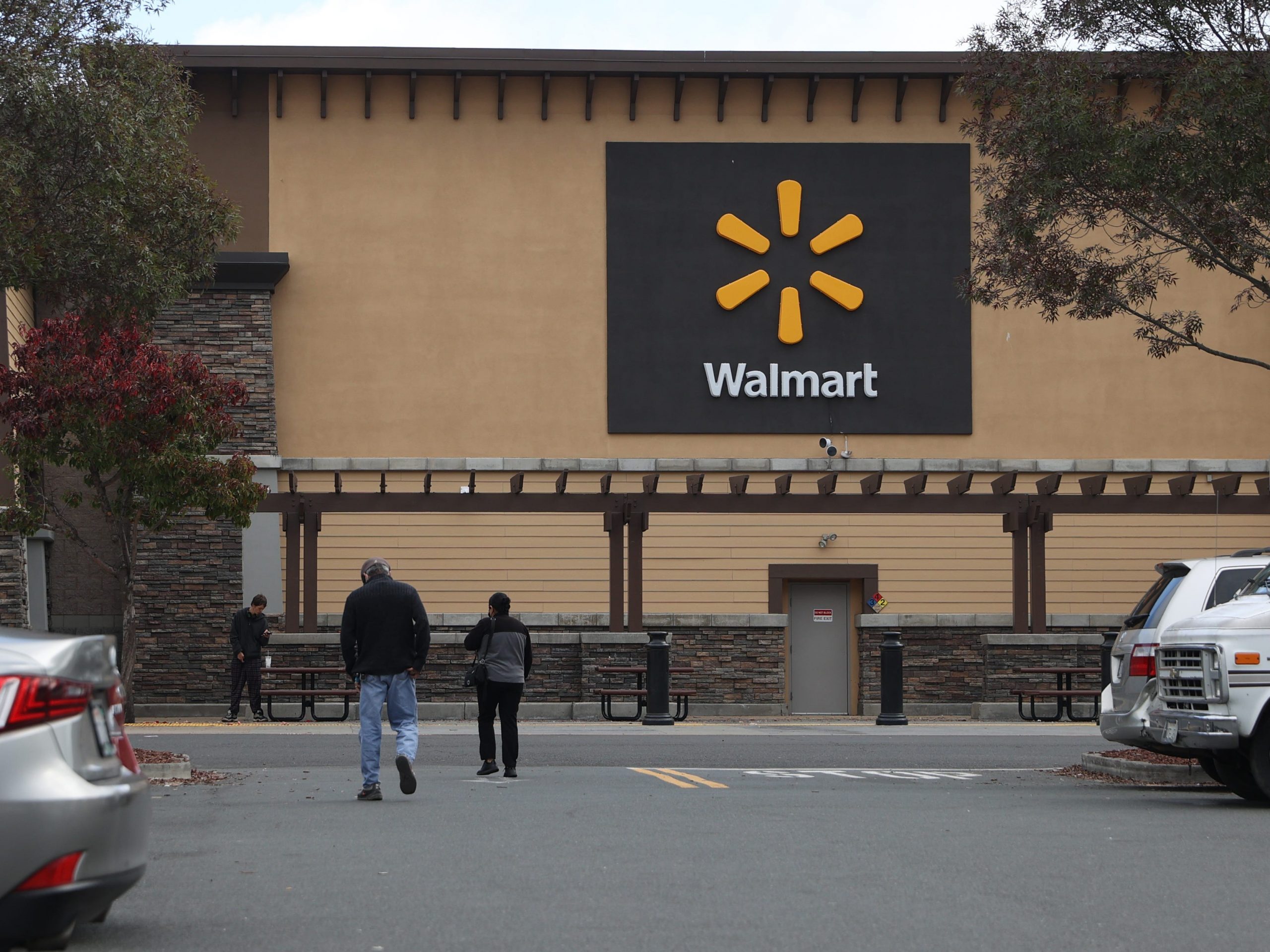 Customers enter a Walmart store on November 16, 2021 in American Canyon, California.