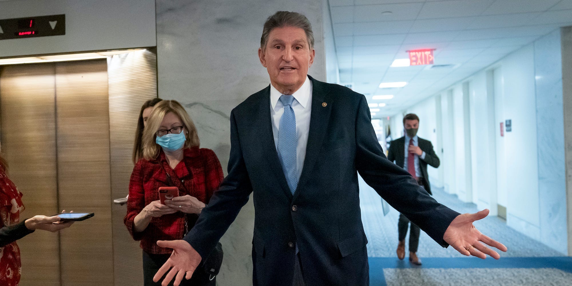 In this Dec. 13, 2021, photo, Sen. Joe Manchin, D-W.Va., leaves his office after speaking with President Joe Biden about his long-stalled domestic agenda, at the Capitol in Washington.