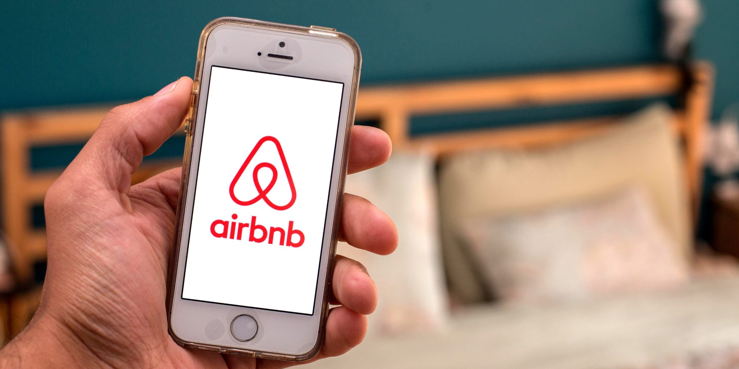 In this photo illustration, the Airbnb app seen displayed on a smartphone screen.