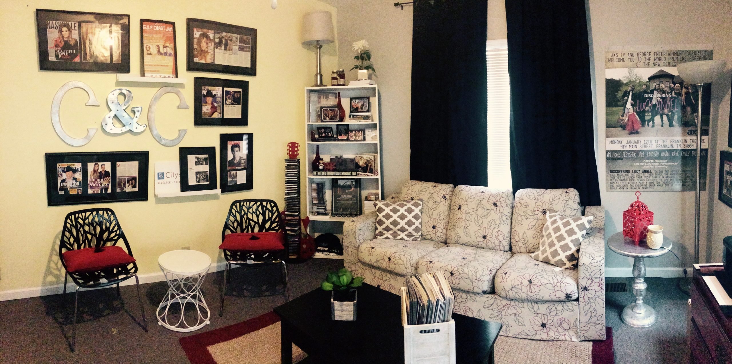 The writer's former office space with a couch, cream walls, and decor