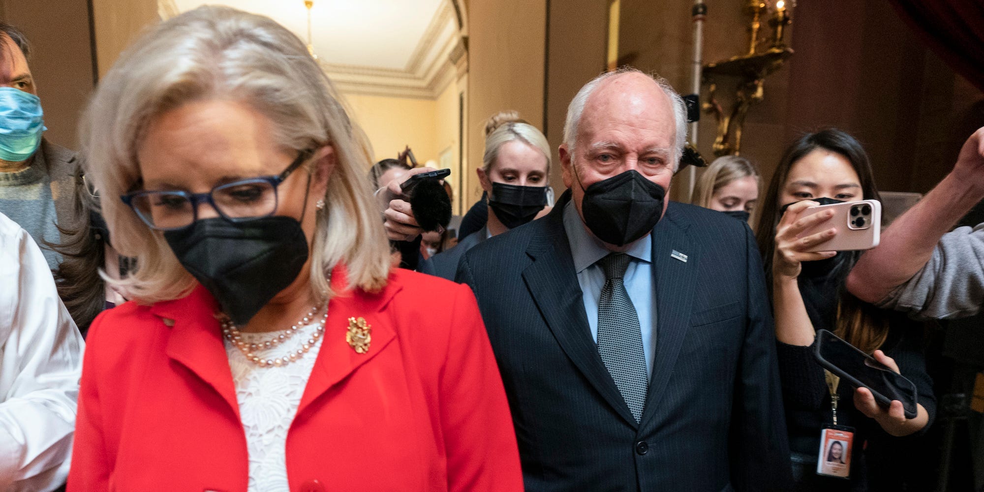 Former Vice President Dick Cheney walks with his daughter Rep. Liz Cheney, R-Wyo., vice chair of the House panel investigating the Jan. 6 U.S. Capitol insurrection, in the Capitol Rotunda at the Capitol in Washington, Thursday, Jan. 6, 2022.