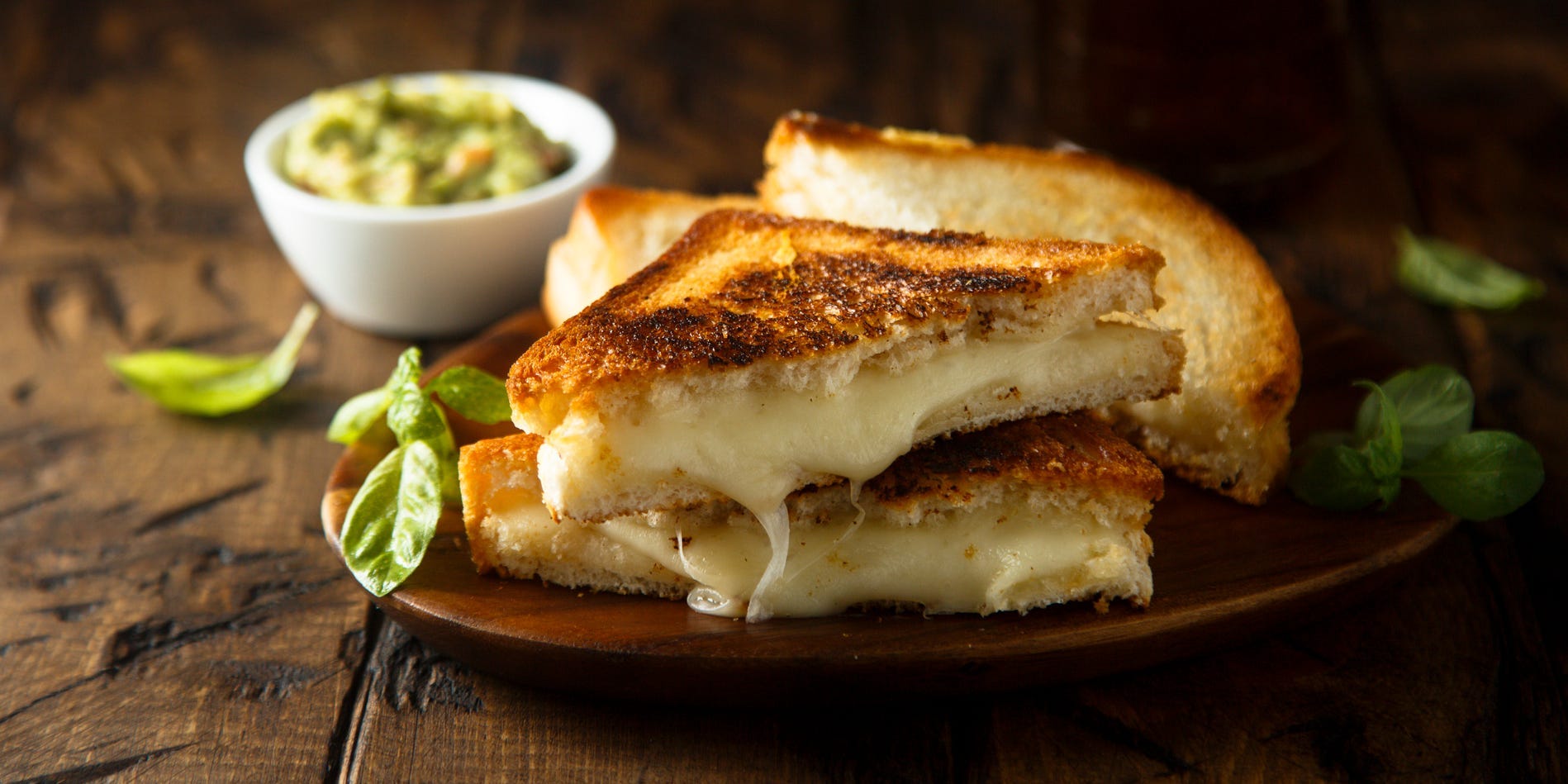 A melty grilled cheese sandwich on a plate