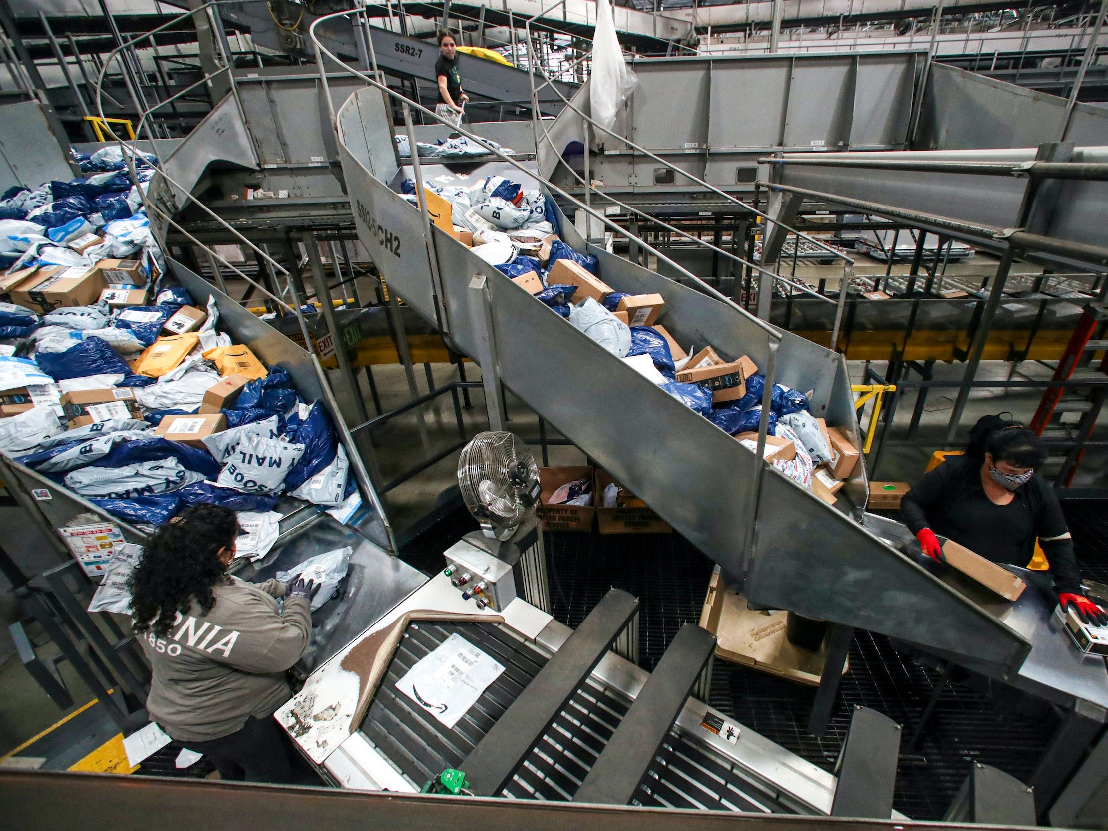 Conveyor belts carrying packages for sorting and delivery at a UPS air hub