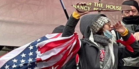 Capitol rioter emily hernandez with a piece of Pelosi's sign