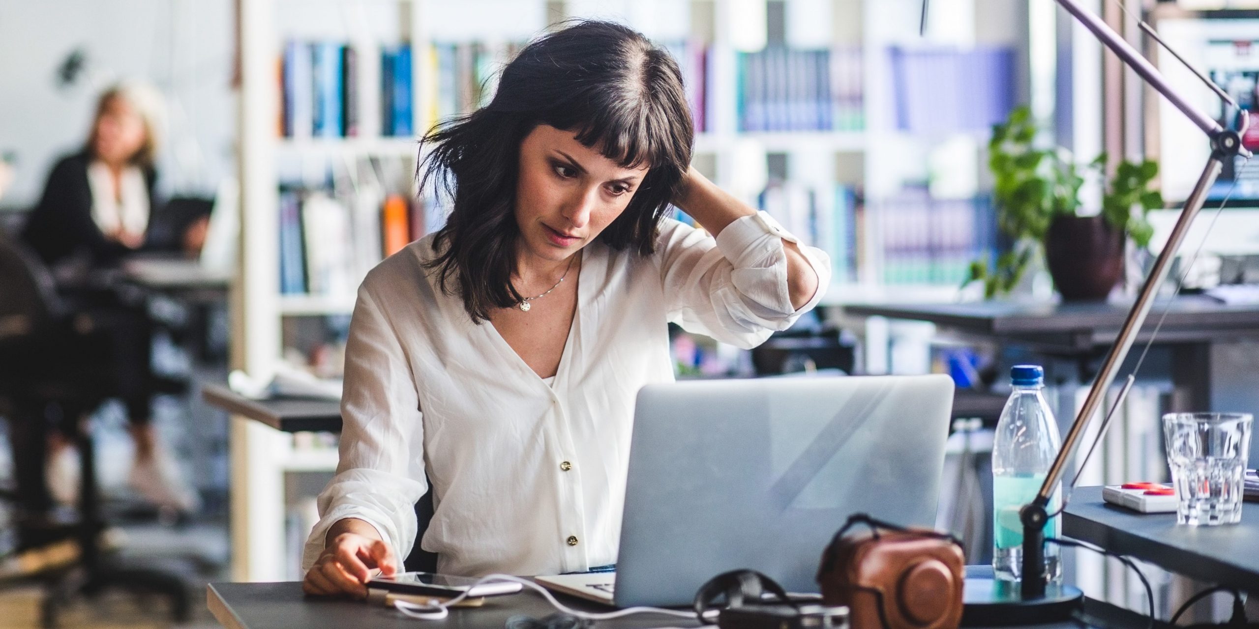 Businesswoman looking at a laptop.
