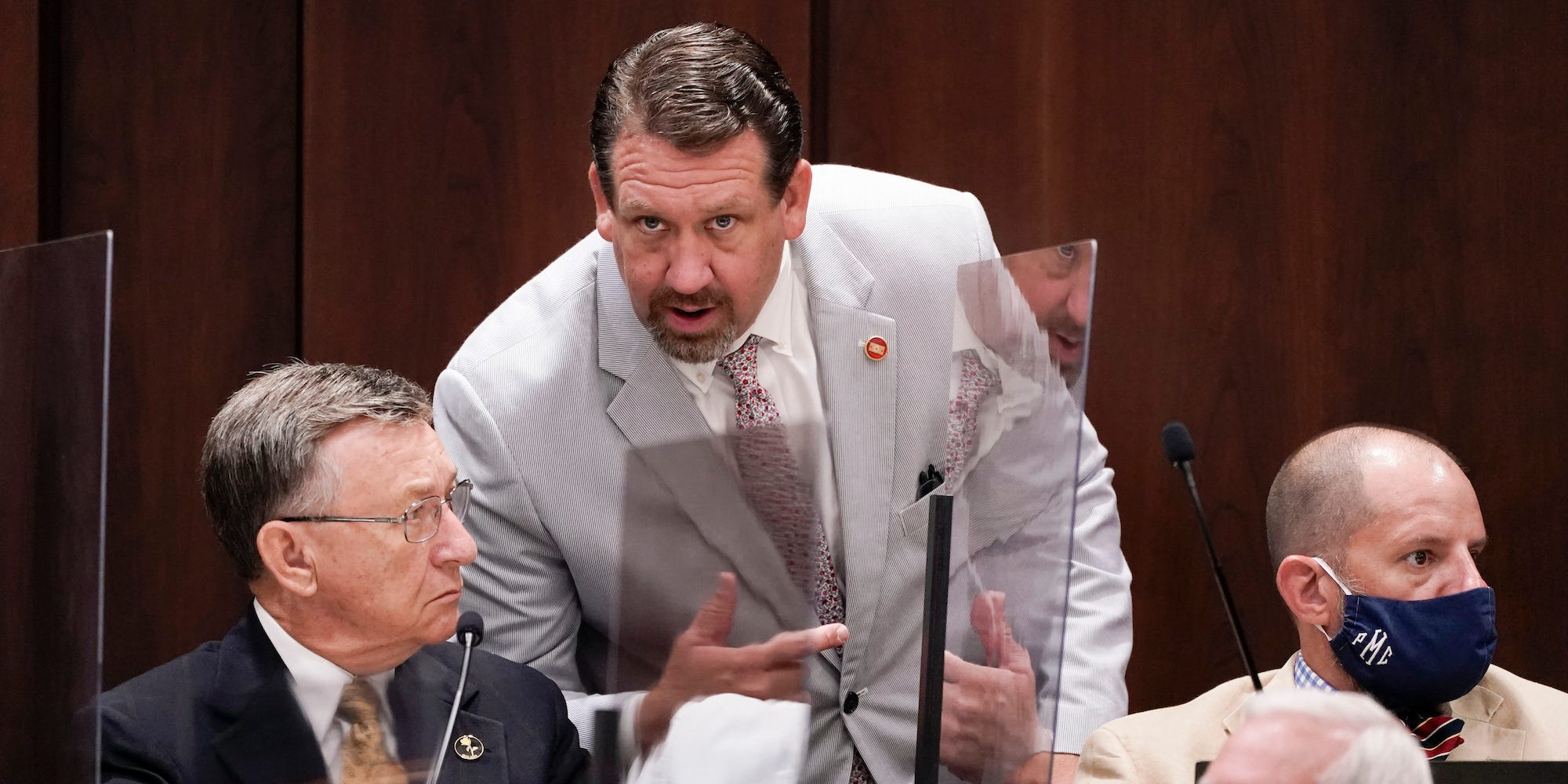 Rep. Jeremy Faison, R-Cosby, center, talks with Rep. Dan Howell, R-Georgetown, left, during a meeting, Aug. 11, 2020, in Nashville, Tenn.