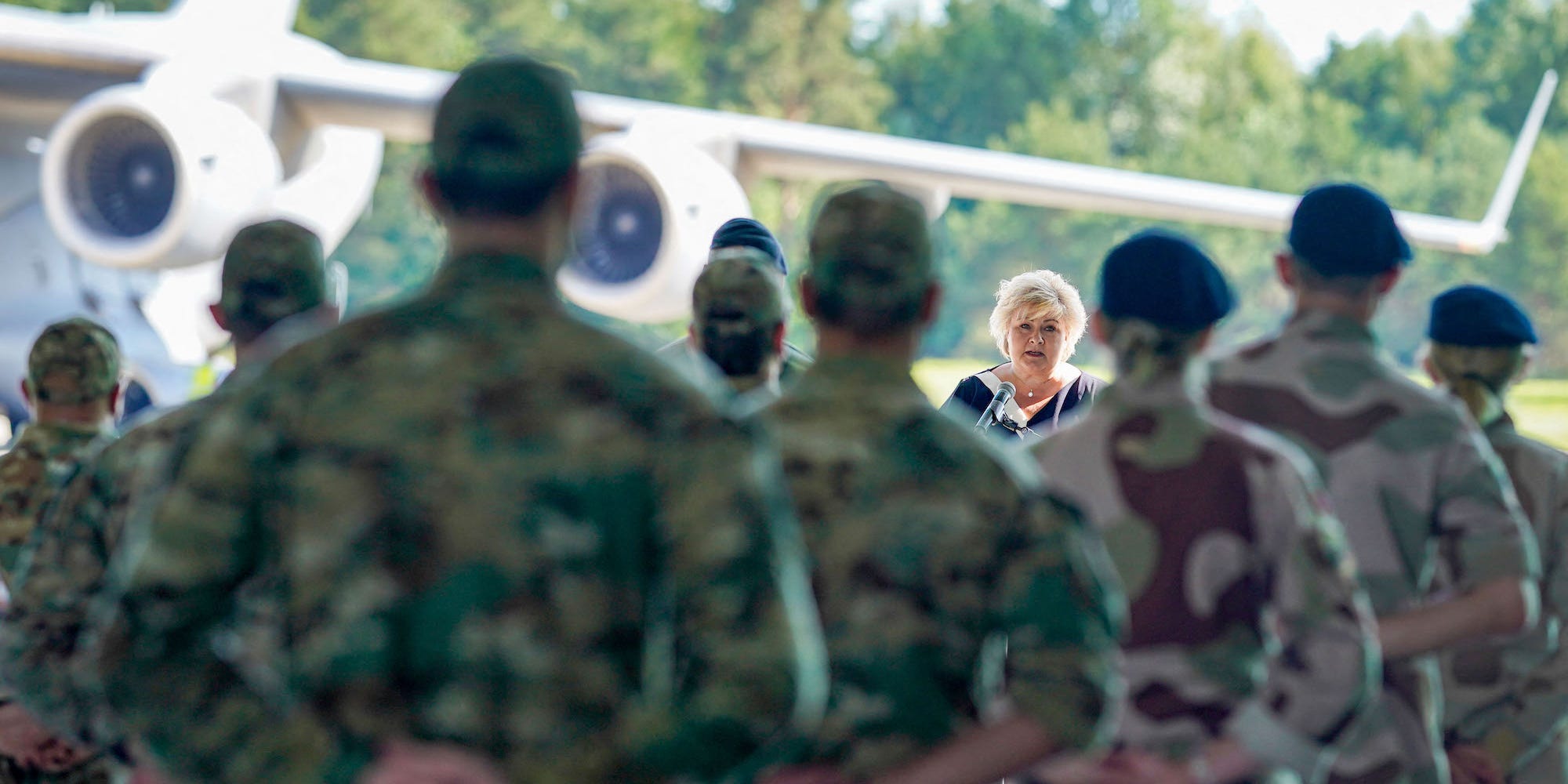 Prime Minister Erna Solberg gives a speech during a reception for the last Norwegian combat soldiers who arrived by plane from Afghanistan at the military part of the Gardermoen airport near Oslo on June 26, 2021.