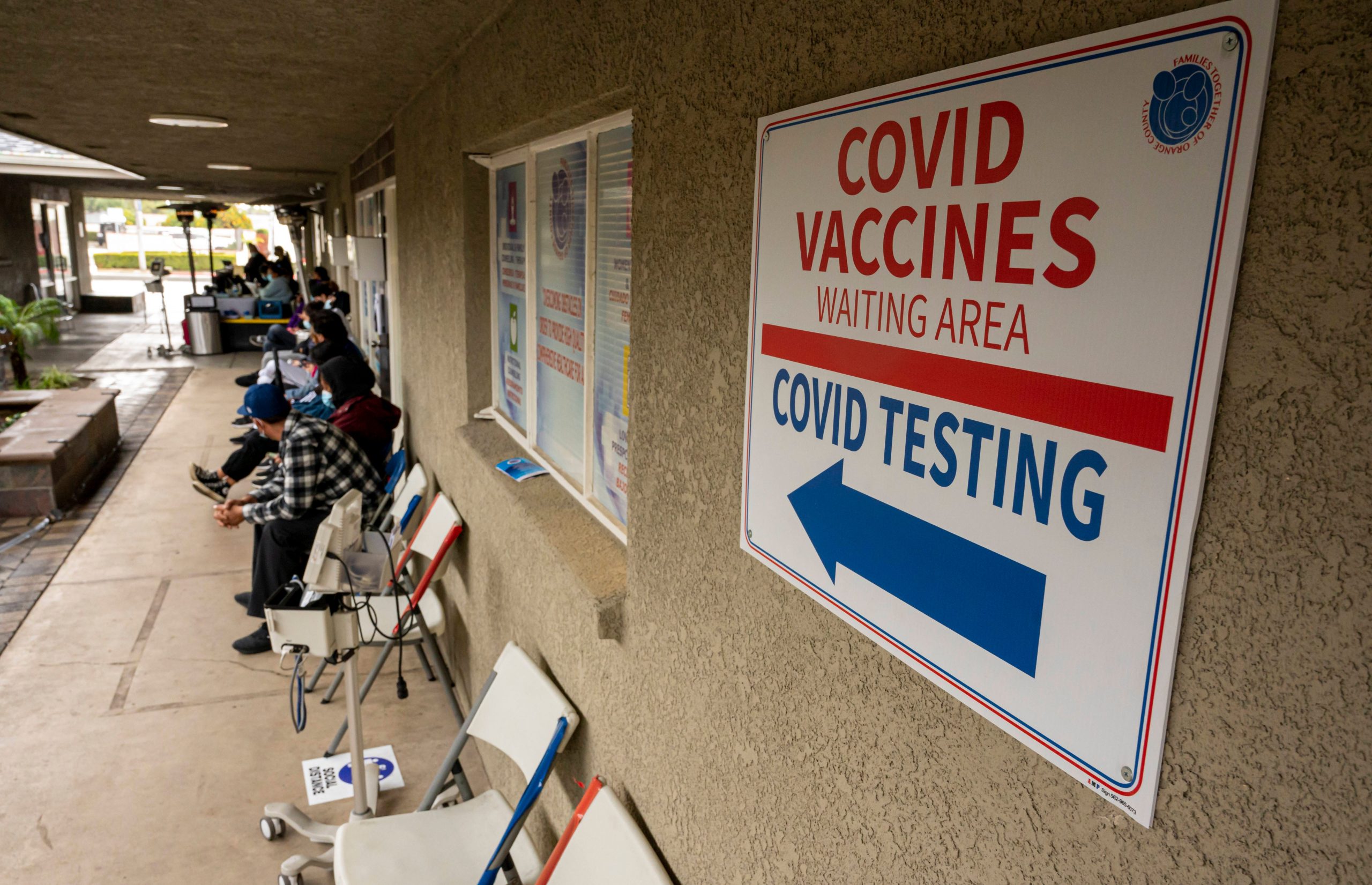 A sign at Families Together of Orange County health clinic directs people arriving for COVID-19 in Tustin, California.