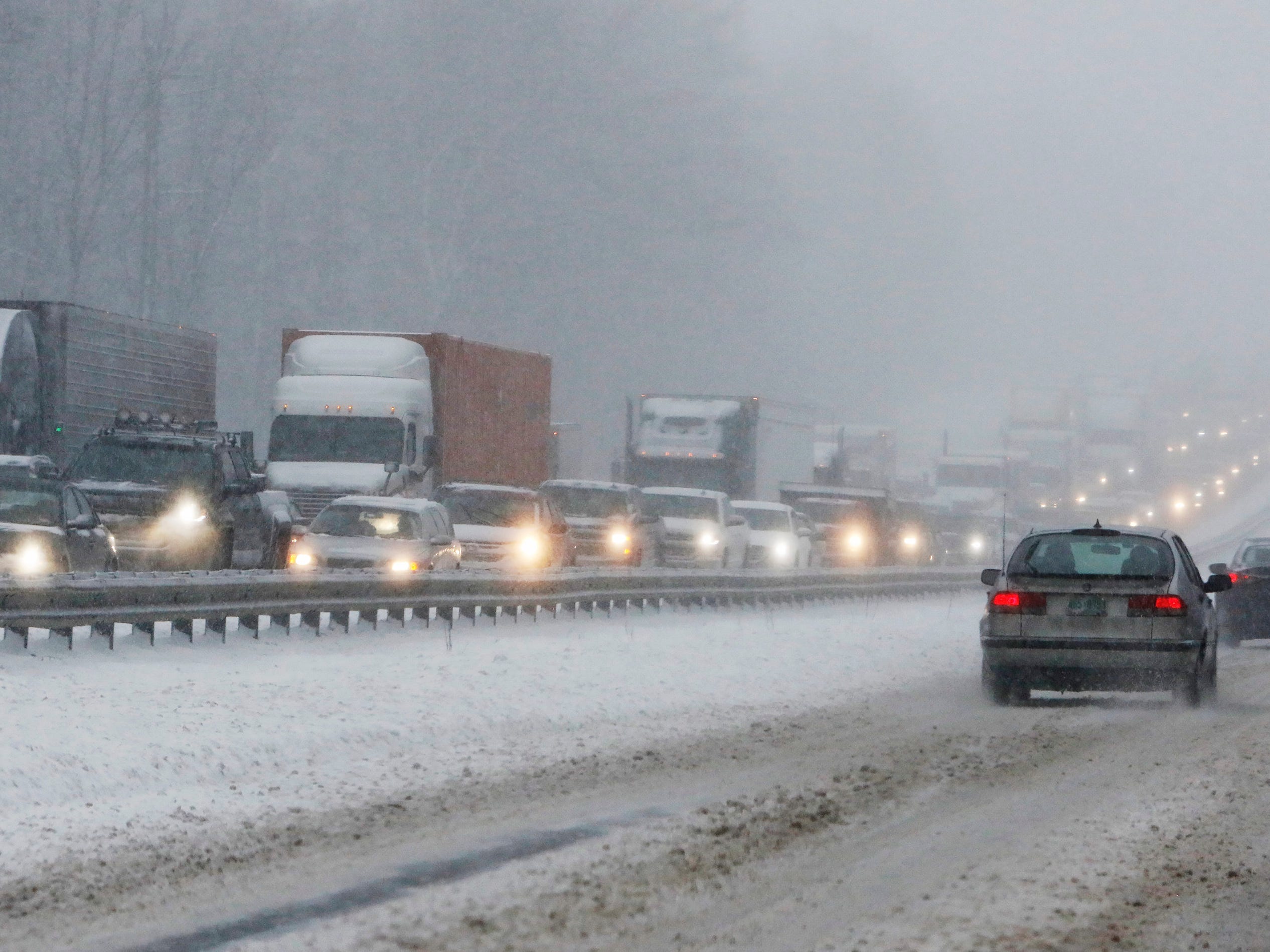 Northbound traffic on I-95 is at a standstill following a tractor trailer that jack-knived in the snowstorm.