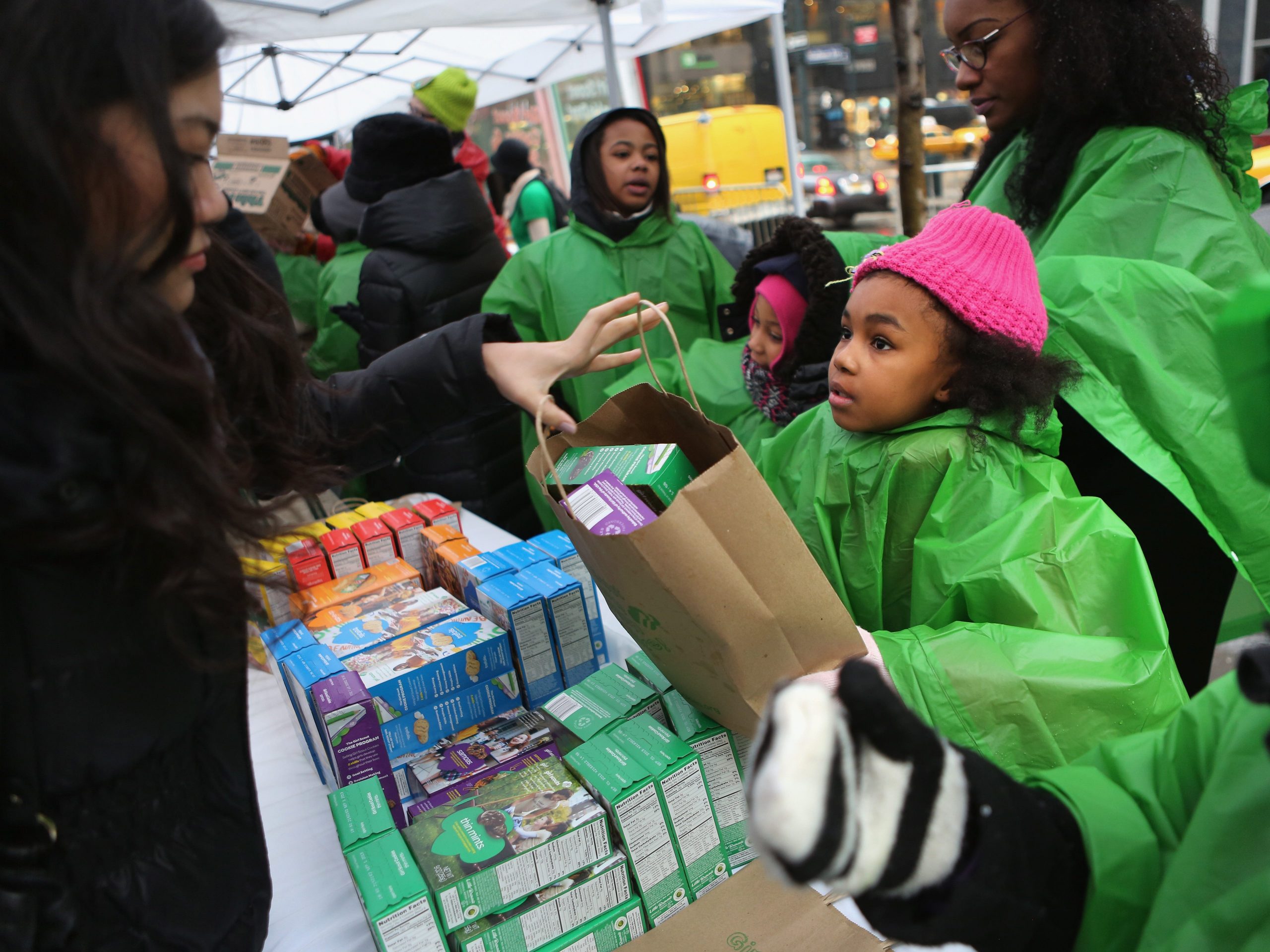 Girl Scouts sell cookies as a winter storm moves in on February 8, 2013 in New York City