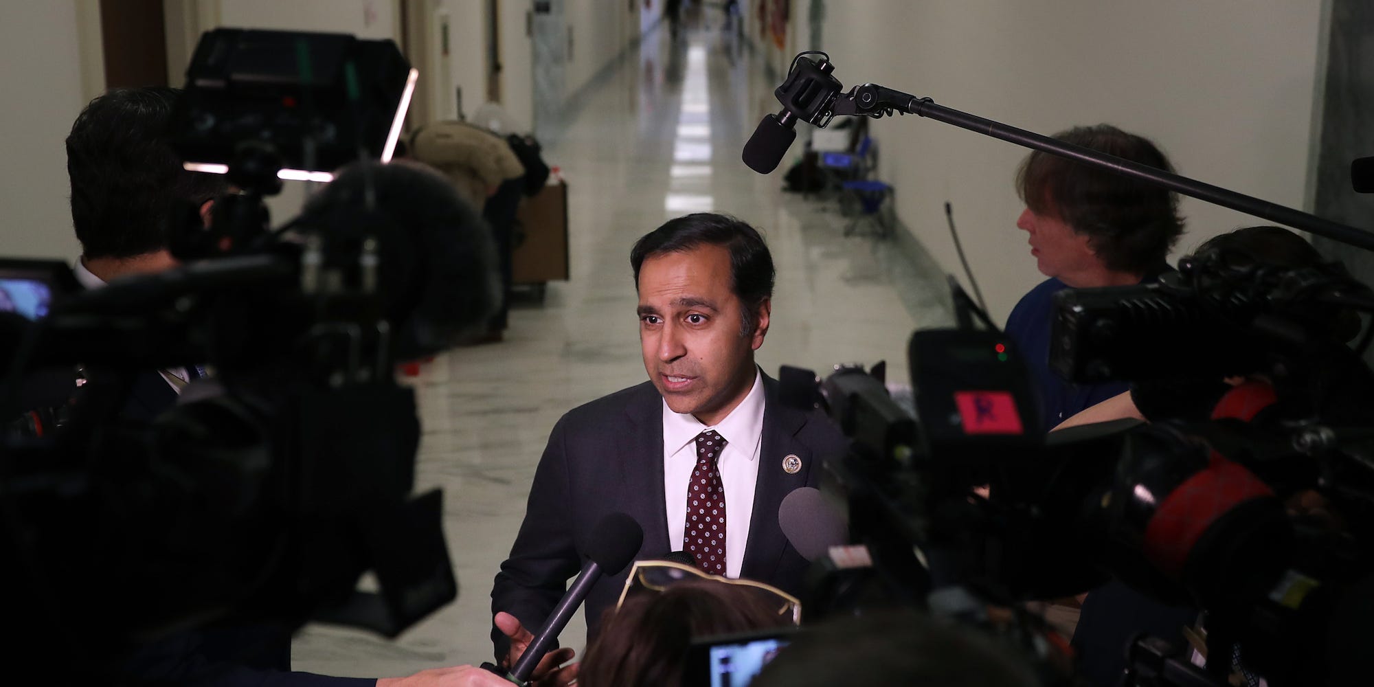 Rep. Raja Krishnamoorthi talks to the press during in the Rayburn House Office Building on October 19, 2018.