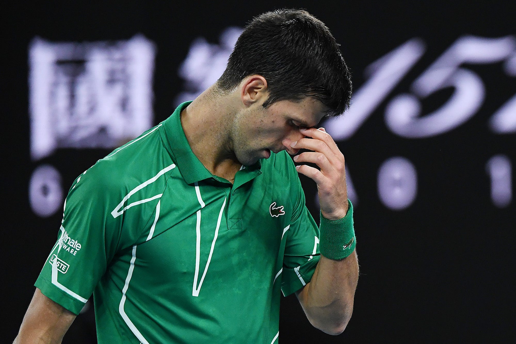 Novak Djokovic of Serbia reacts during his Men's Singles Final match against Dominic Thiem of Austria on day fourteen of the 2020 Australian Open at Melbourne Park