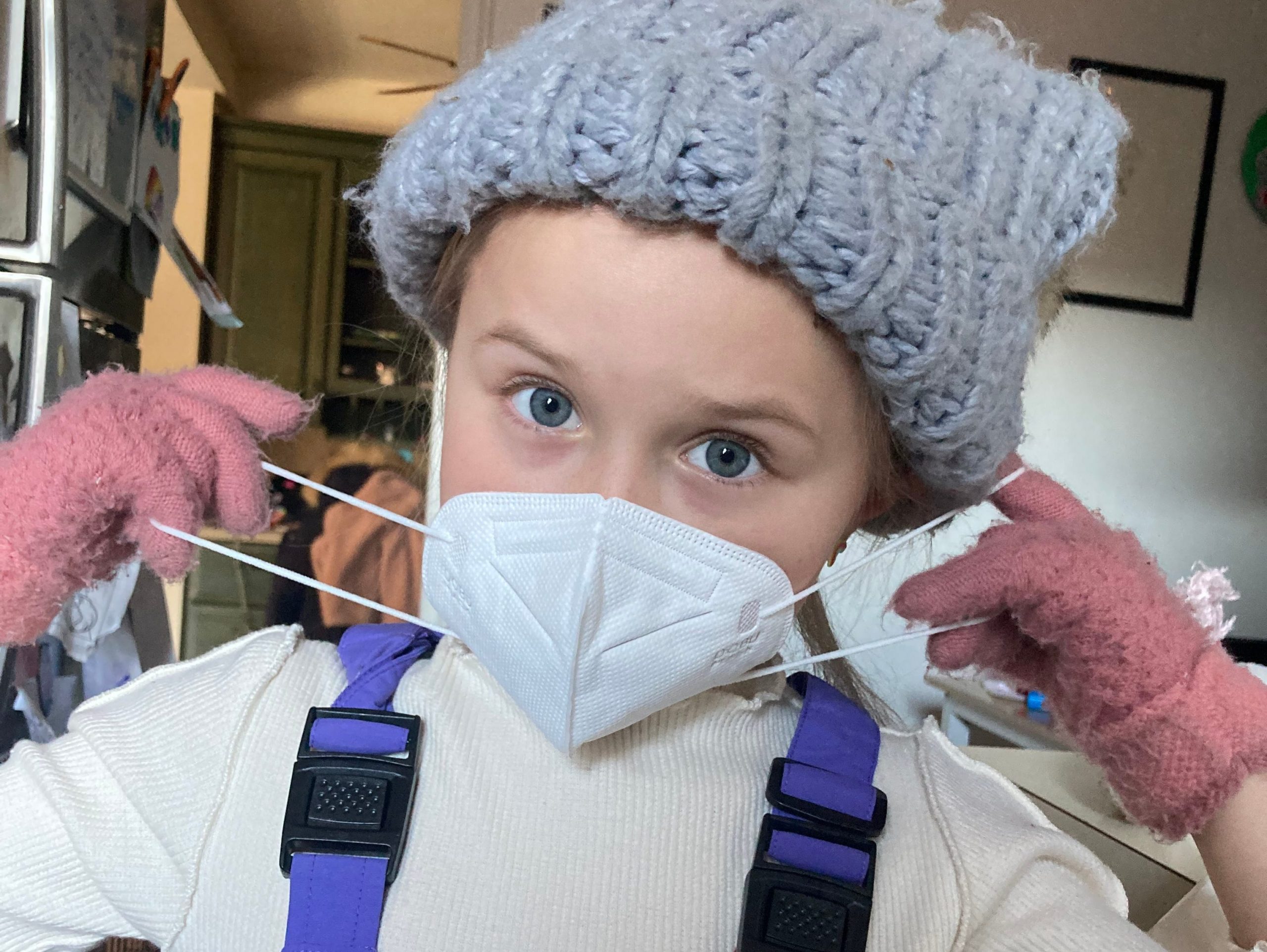 The author's daughter wearing a mask