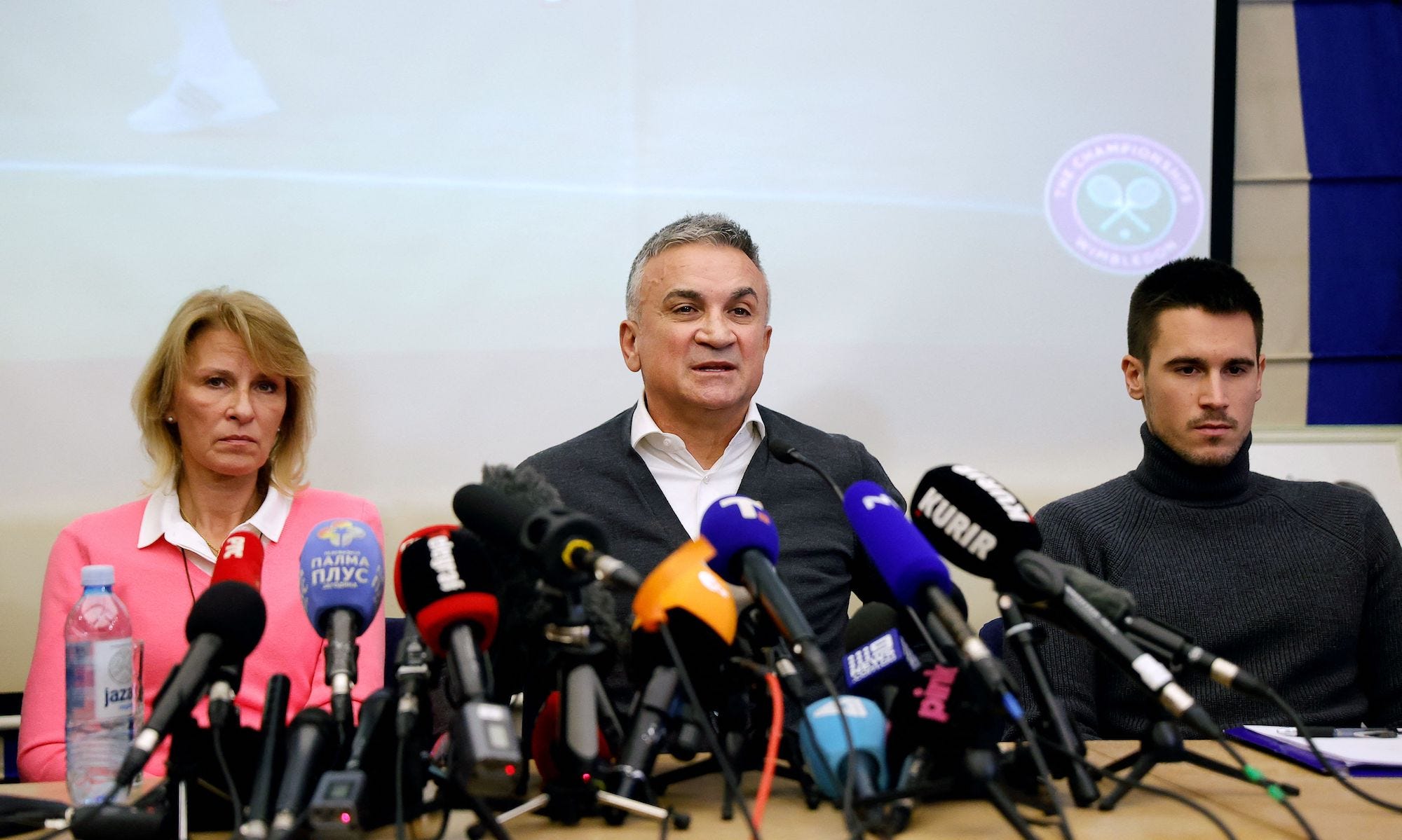 Serbian tennis player Novak Djokovic's (L-R) mother Dijana, father Srdjan and brother Djordje hold a press conference in Belgrade, on January 10, 2022, after a judge in Australia overturned the cancellation of Novak Djokovic's visa over his Covid-19 vaccination status, ending five days of detention in Melbourne, where he had arrived ahead of the Australian Open. - Djokovic was back on the court training after his release, but may still be excluded from the year's first grand slam event because of his Covid-19 vaccination status