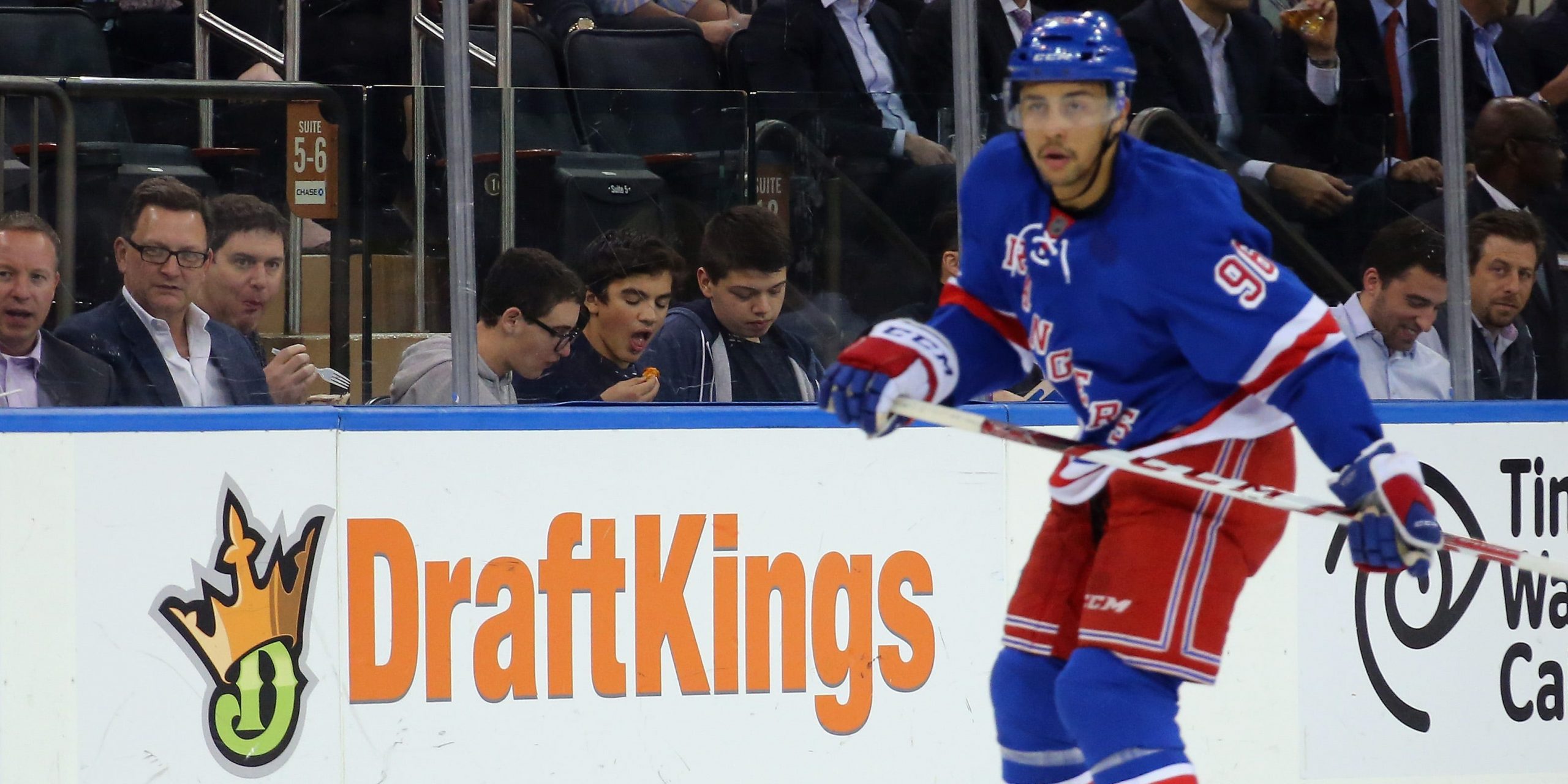 A member of the New York Rangers skates near a DraftKings logo at Madison Square Garden in 2015.