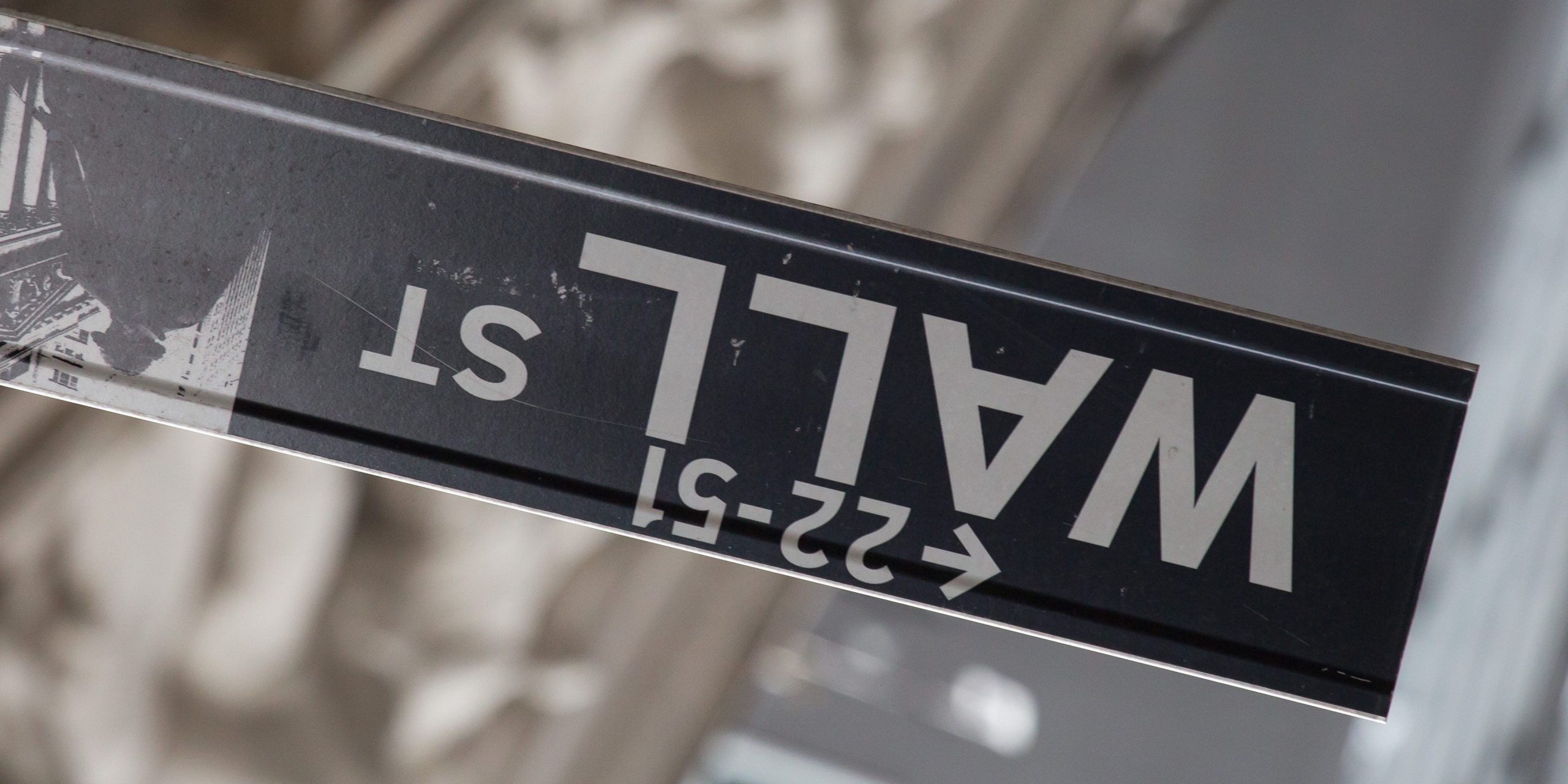 Wall Street sign turned upside down