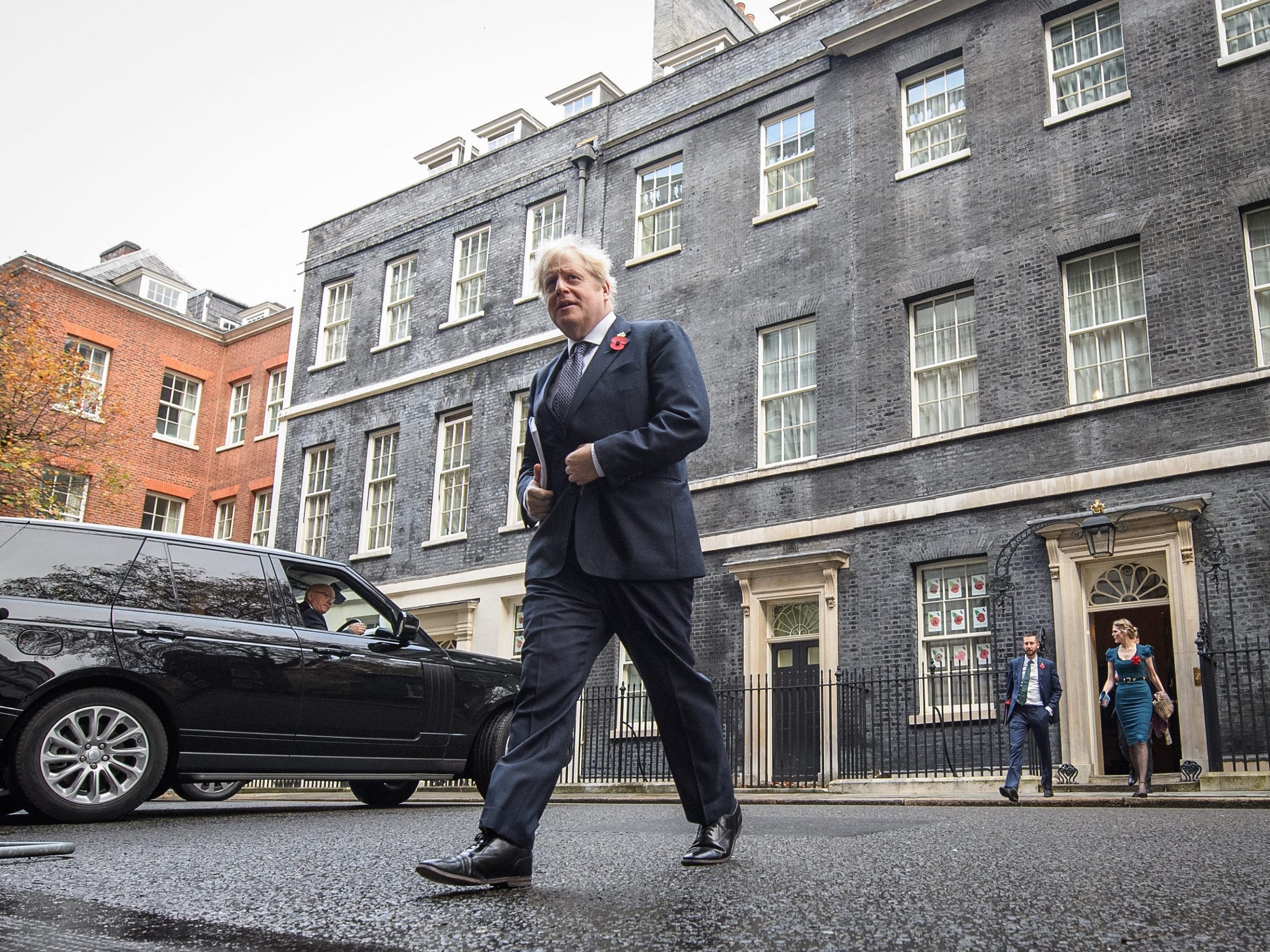 Britain's Prime Minister Boris Johnson leaves number 10, Downing Street as he heads to the weekly Cabinet meeting at the Foreign Office on November 10, 2020 in London, England.