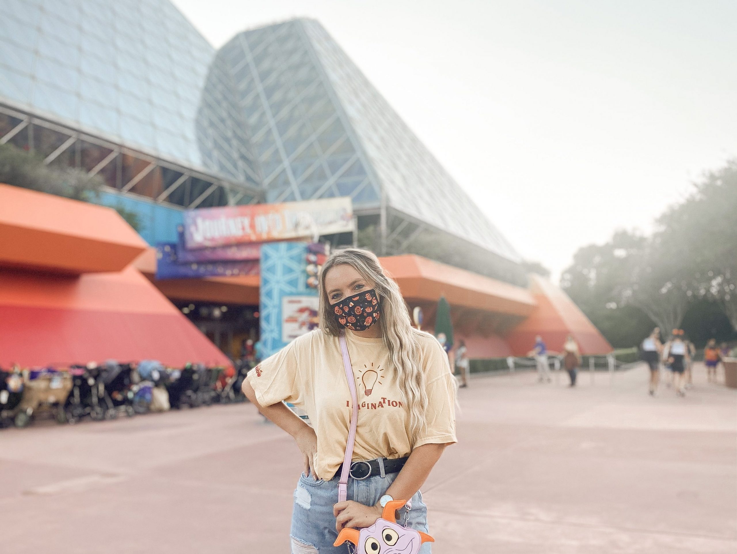 kayleigh in front of journey into imagination ride at epcot disney world