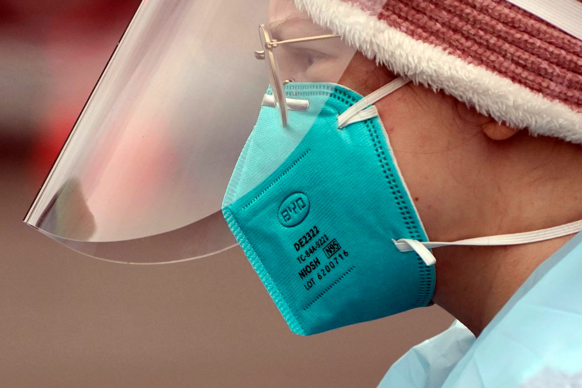 A woman wearing an N95 mask