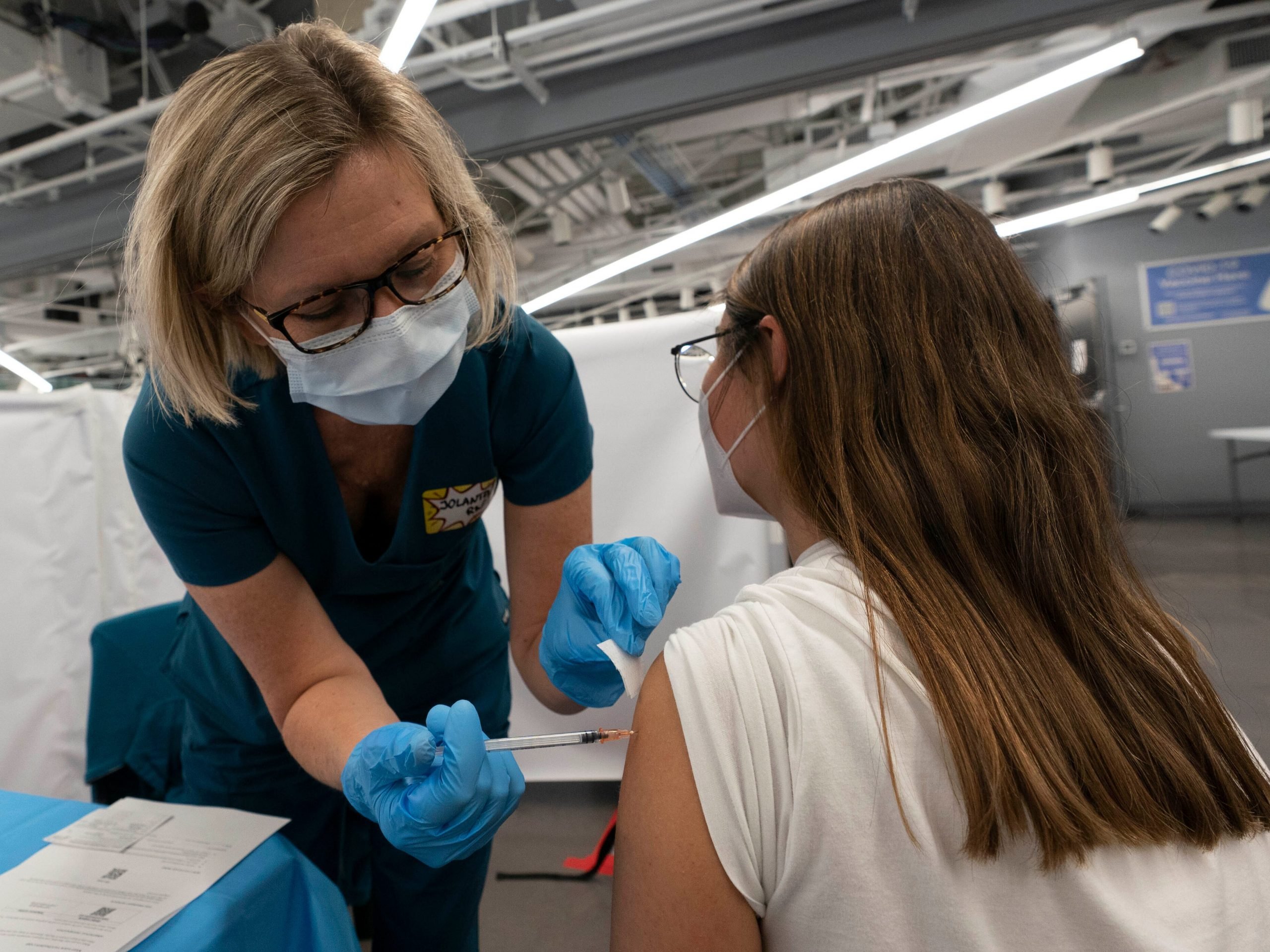 A New York woman receives a Pfizer COVID-19 vaccination.