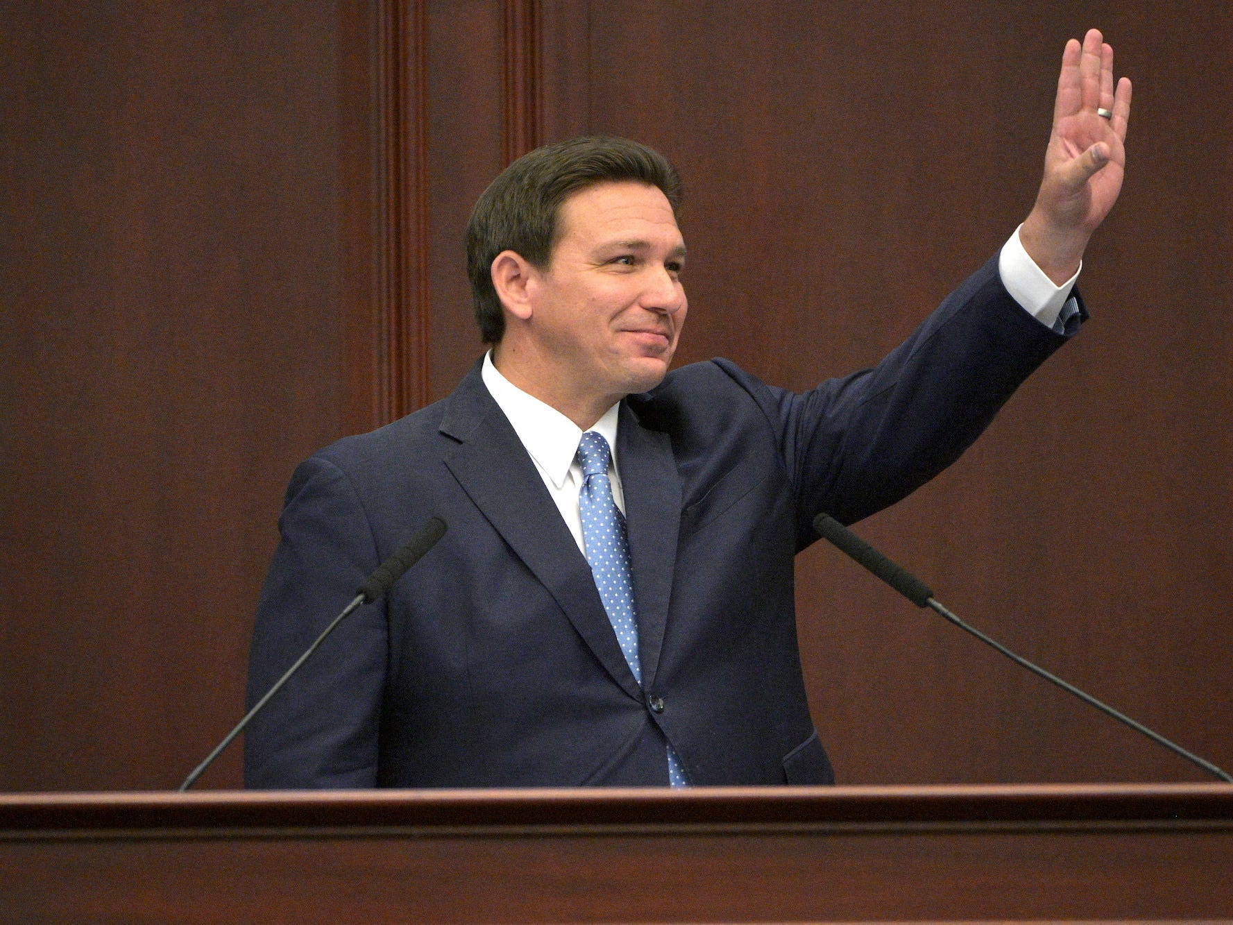 Gov. Ron DeSantis gestures during his annual address to state lawmakers in the Florida capitol of Tallahassee.