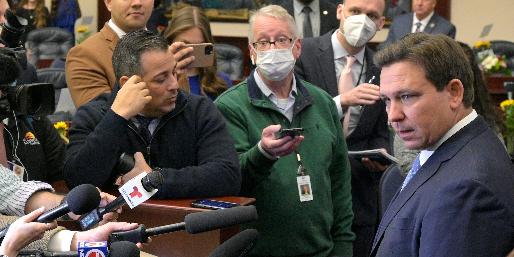 Florida Gov. Ron DeSantis, right, answers questions from reporters after addressing a joint session of a legislative session, Tuesday, Jan. 11, 2022, in Tallahassee, Florida.